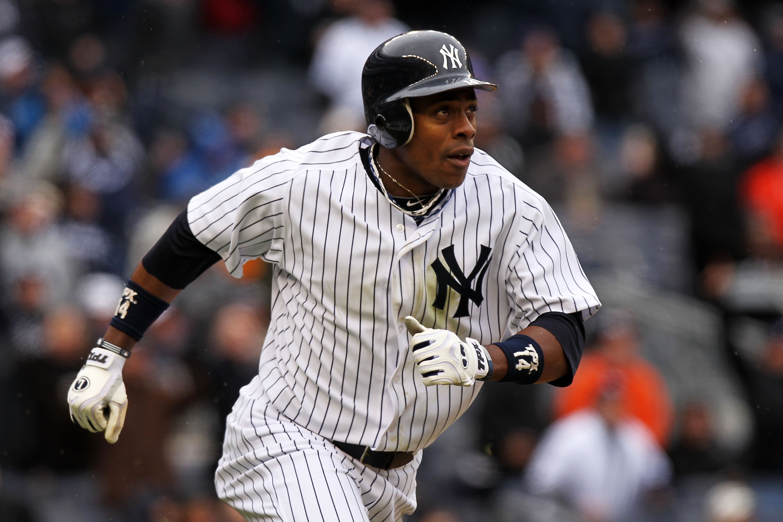 NEW YORK, NY - MARCH 31:  Curtis Granderson #14 of the New York Yankees runs down the first baseline during the game against the Detroit Tigers on Opening Day at Yankee Stadium on March 31, 2011 in the Bronx borough of New York City.  (Photo by Nick Laham