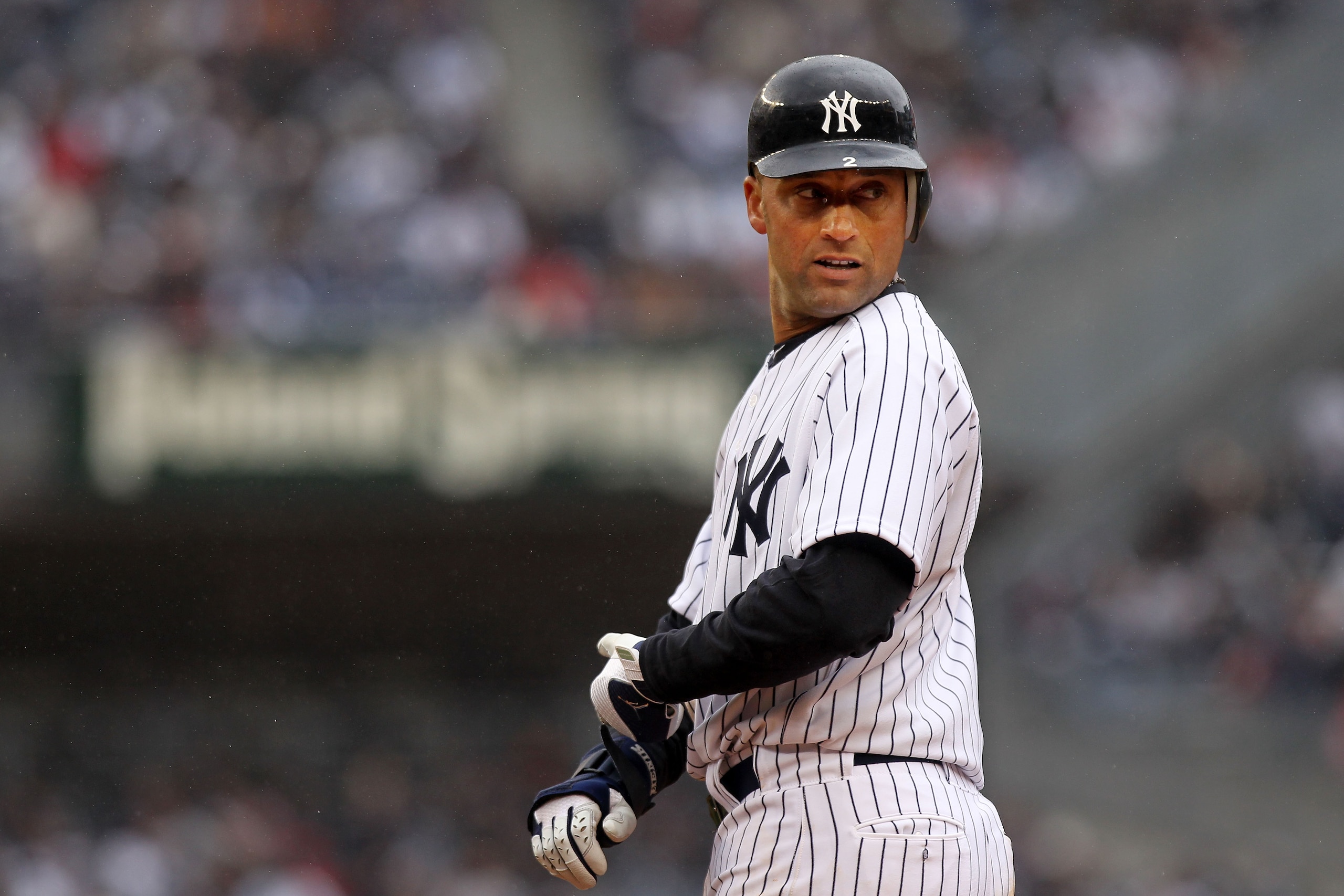 NEW YORK, NY - MARCH 31:  Derek Jeter #2 of the New York Yankees looks on during the game against the Detroit Tigers on Opening Day at Yankee Stadium on March 31, 2011 in the Bronx borough of New York City.  (Photo by Nick Laham/Getty Images)