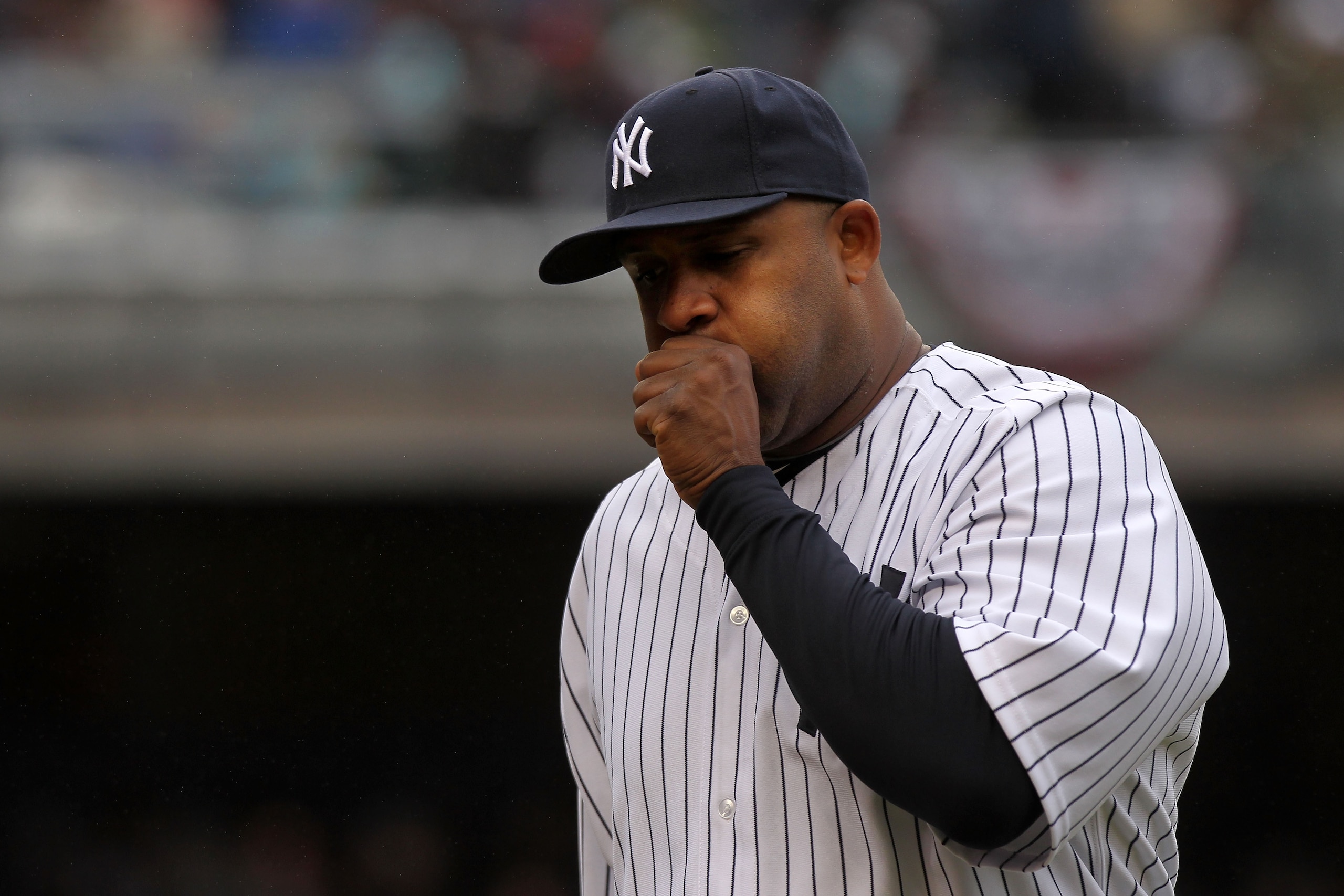 NEW YORK, NY - MARCH 31:  CC Sabathia #52 of the New York Yankees warms up his hand during the game against the Detroit Tigers on Opening Day at Yankee Stadium on March 31, 2011 in the Bronx borough of New York City.  (Photo by Nick Laham/Getty Images)