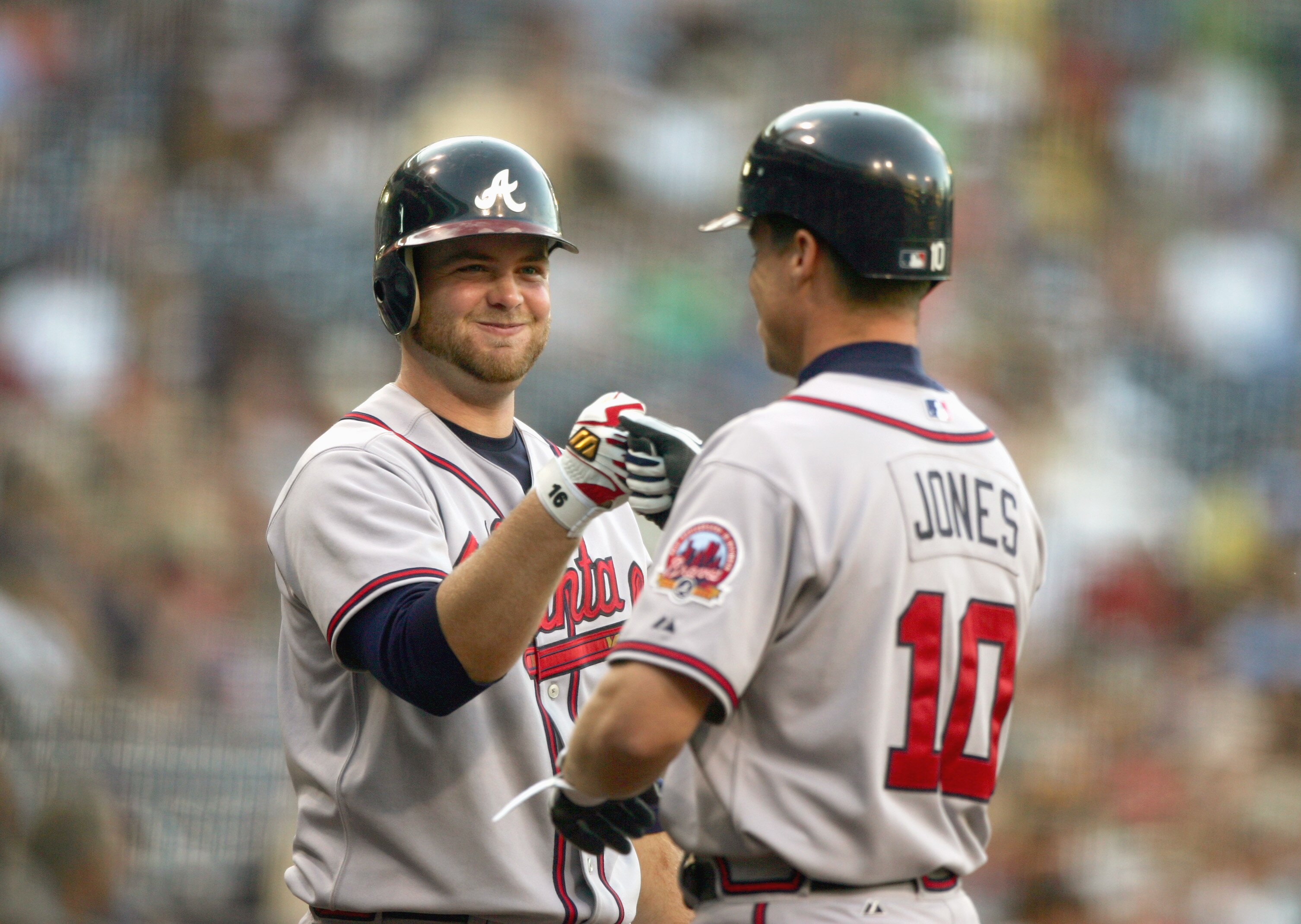 SAN DIEGO - JULY 14:  Brian McCann #16 of the Atlanta Braves celebrates with Chipper Jones #10 during the game against the San Diego Padres on July 14, 2006 at PETCO Park in San Diego, California. (Photo by Donald Miralle/Getty Images)