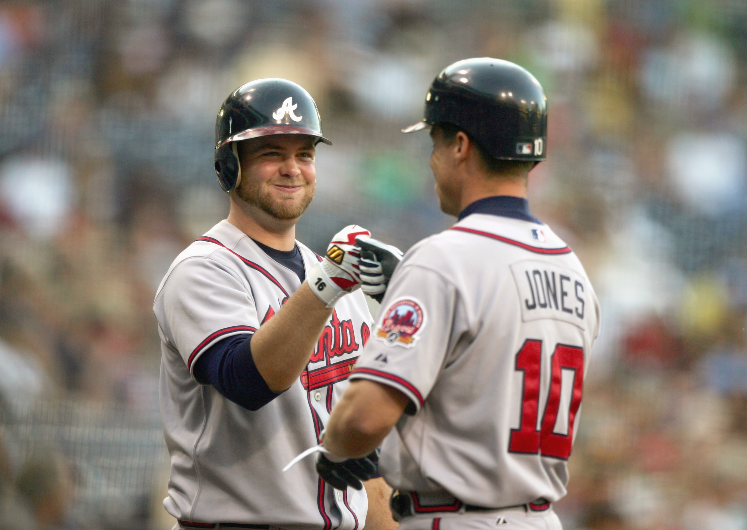 SAN DIEGO - JULY 14:  Brian McCann #16 of the Atlanta Braves celebrates with Chipper Jones #10 during the game against the San Diego Padres on July 14, 2006 at PETCO Park in San Diego, California. (Photo by Donald Miralle/Getty Images)
