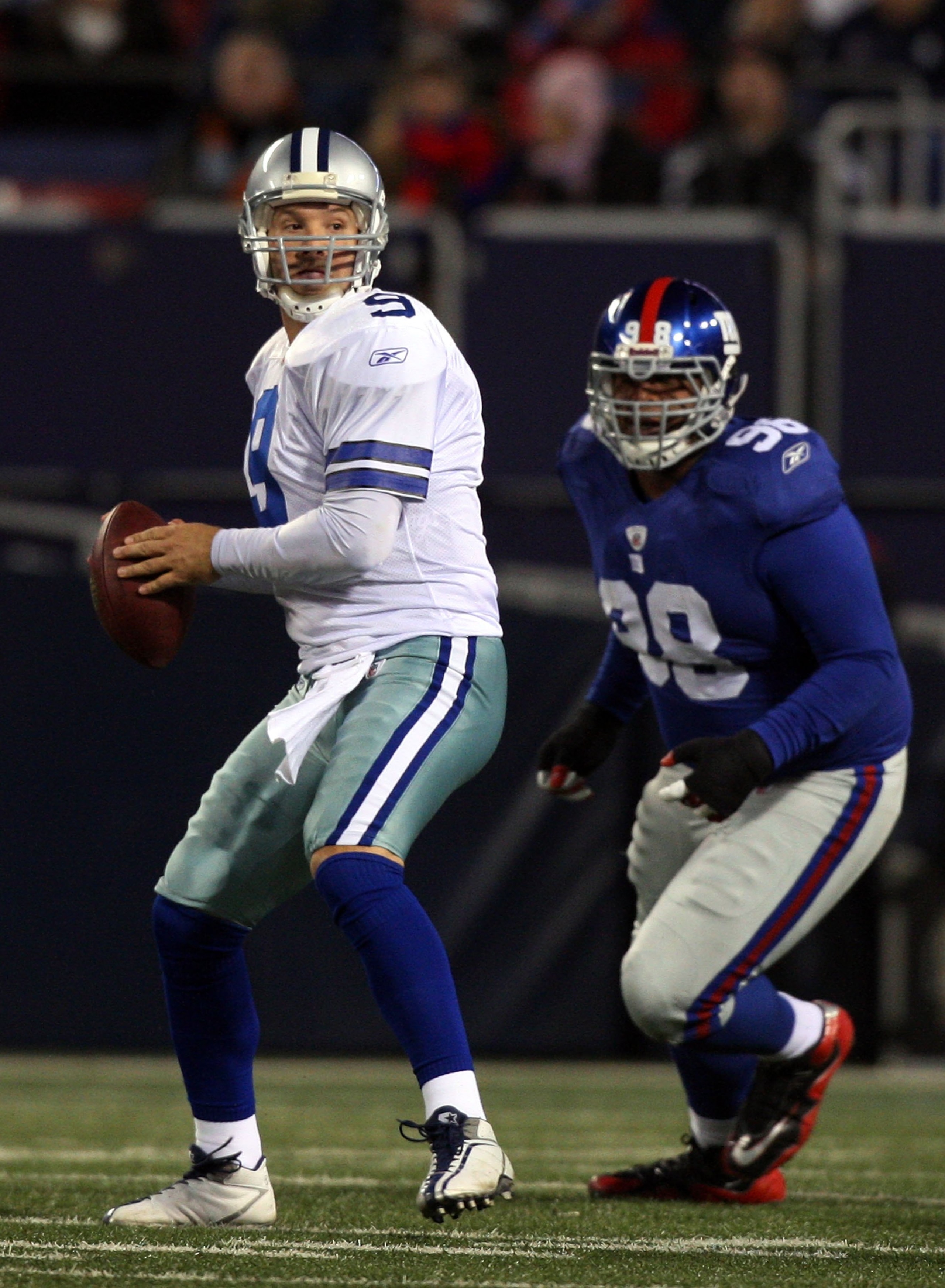 EAST RUTHERFORD, NJ - DECEMBER 06:  Tony Romo #9 of the Dallas Cowboys looks to throw a pass against the New York Giants on December 6, 2009 at Giants Stadium in East Rutherford, New Jersey. The Giants defeated the Cowboys 31-24.  (Photo by Jim McIsaac/Ge