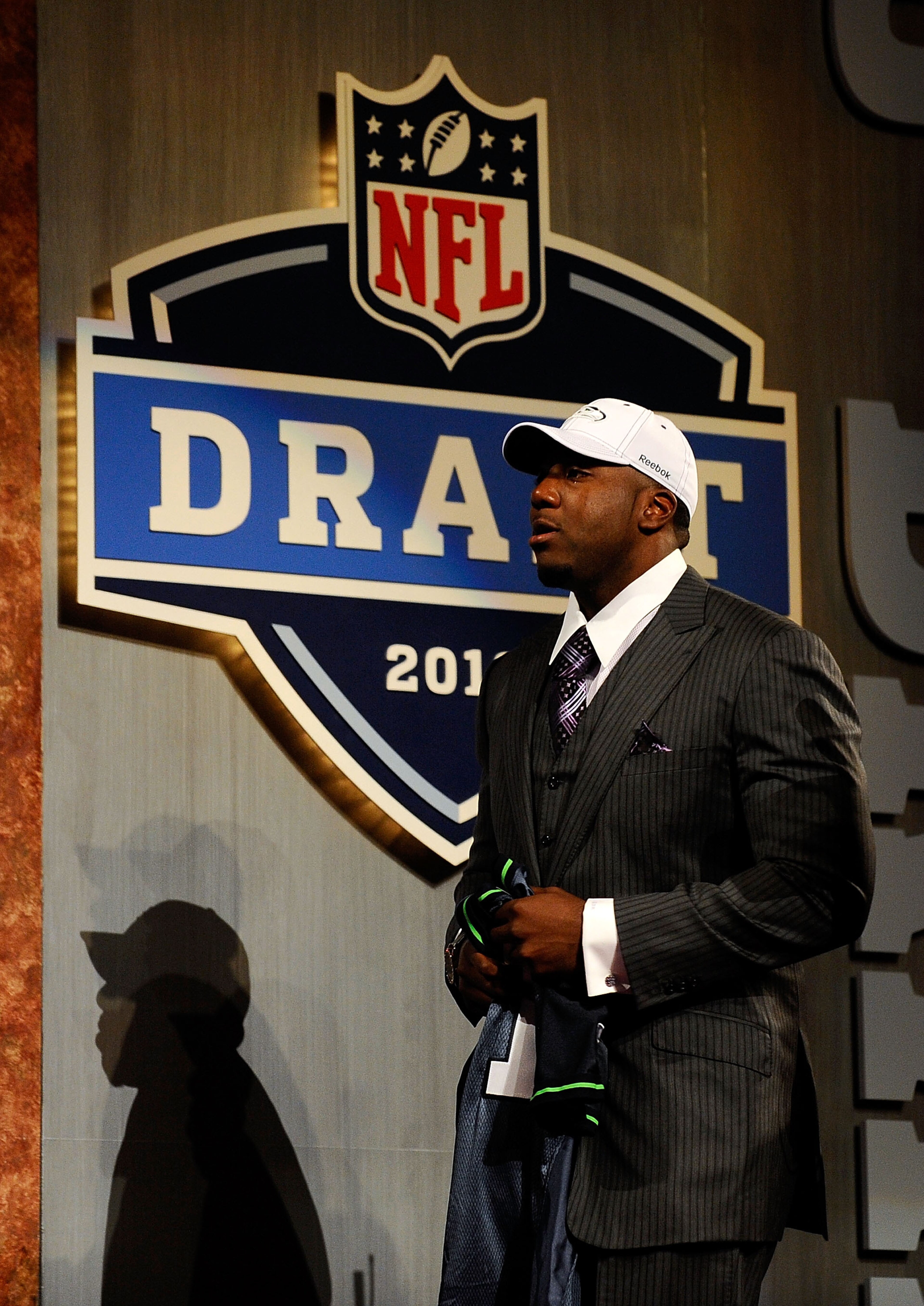 NEW YORK - APRIL 22:  Russell Okung from the Oklahoma State Cowboys walks towards the stage after he was elected #6 overall in the first round by the Seattle Seahawks during the 2010 NFL Draft at Radio City Music Hall on April 22, 2010 in New York City.