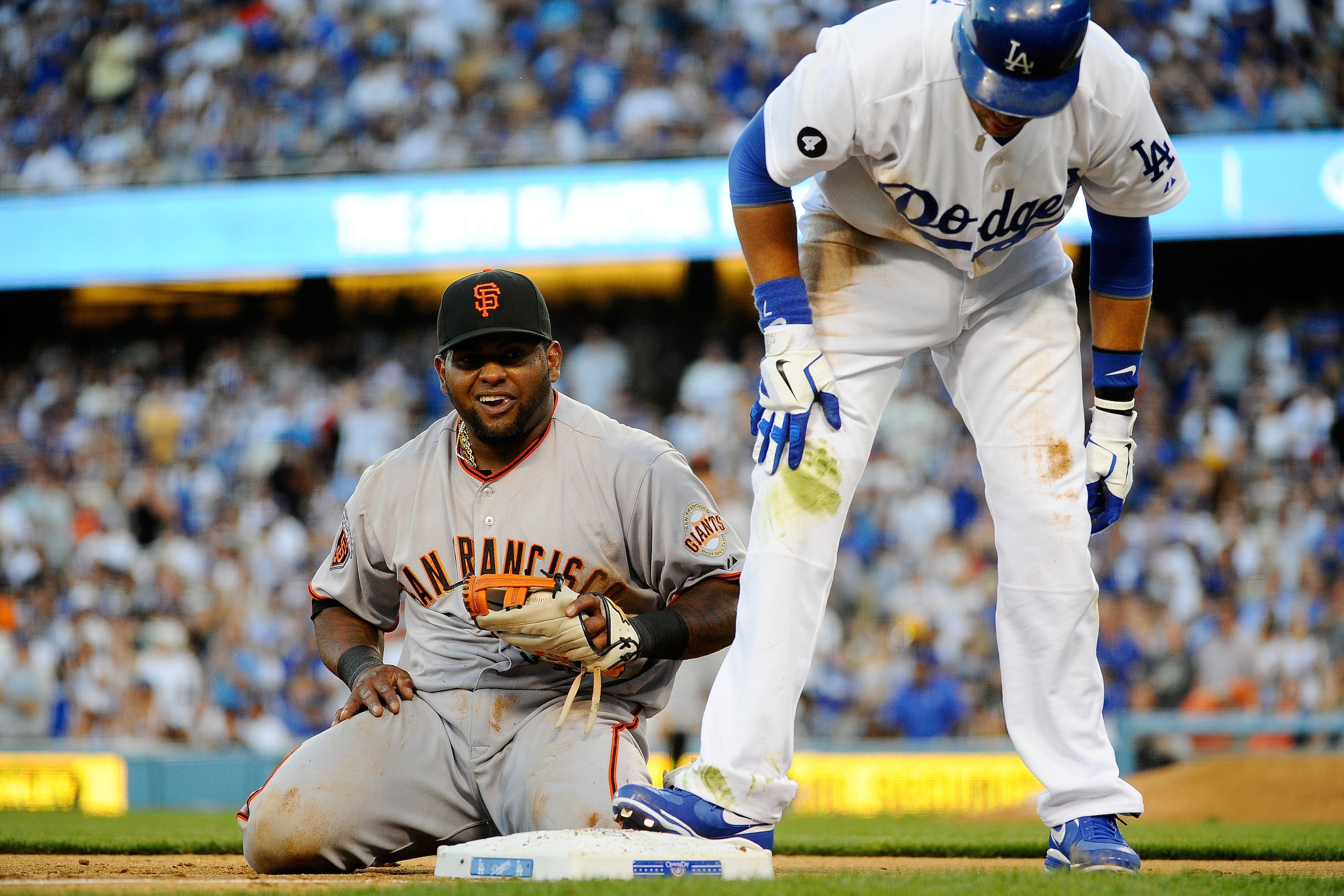 LOS ANGELES, CA - MARCH 31:  Pablo Sandoval #48 of the San Francisco Giants reacts after missing a chance for a double play on James Loney #7 of the Los Angeles Dodgers in the sixth inning of their Opening Day game at Dodger Stadium on March 31, 2011 in L