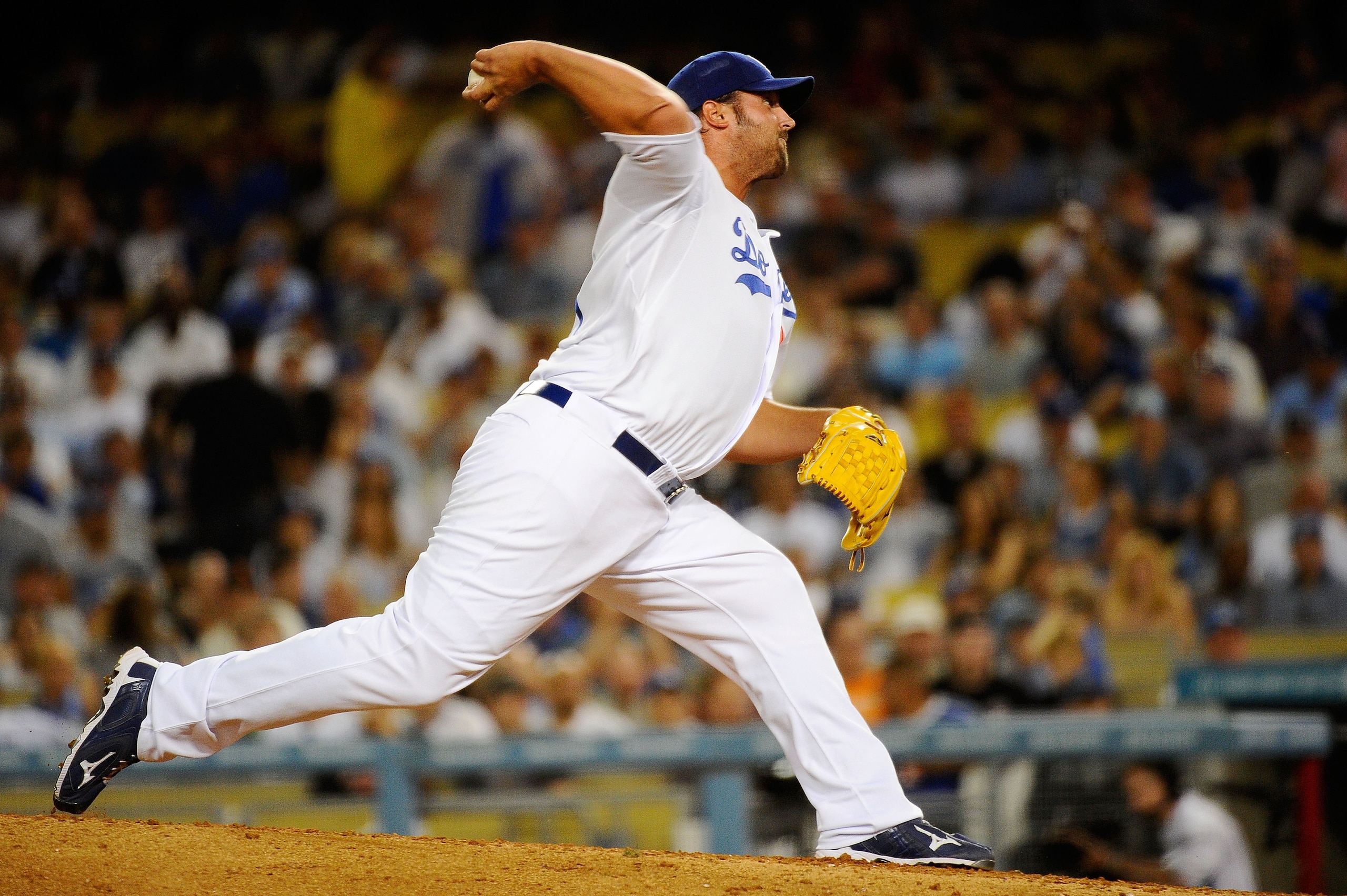 LOS ANGELES, CA - MARCH 31:  Jonathan Broxton #51 of the Los Angeles Dodgers throws a pitch in the ninth inning against the San Francisco Giants on Opening Day at Dodger Stadium on March 31, 2011 in Los Angeles, California.  (Photo by Kevork Djansezian/Ge