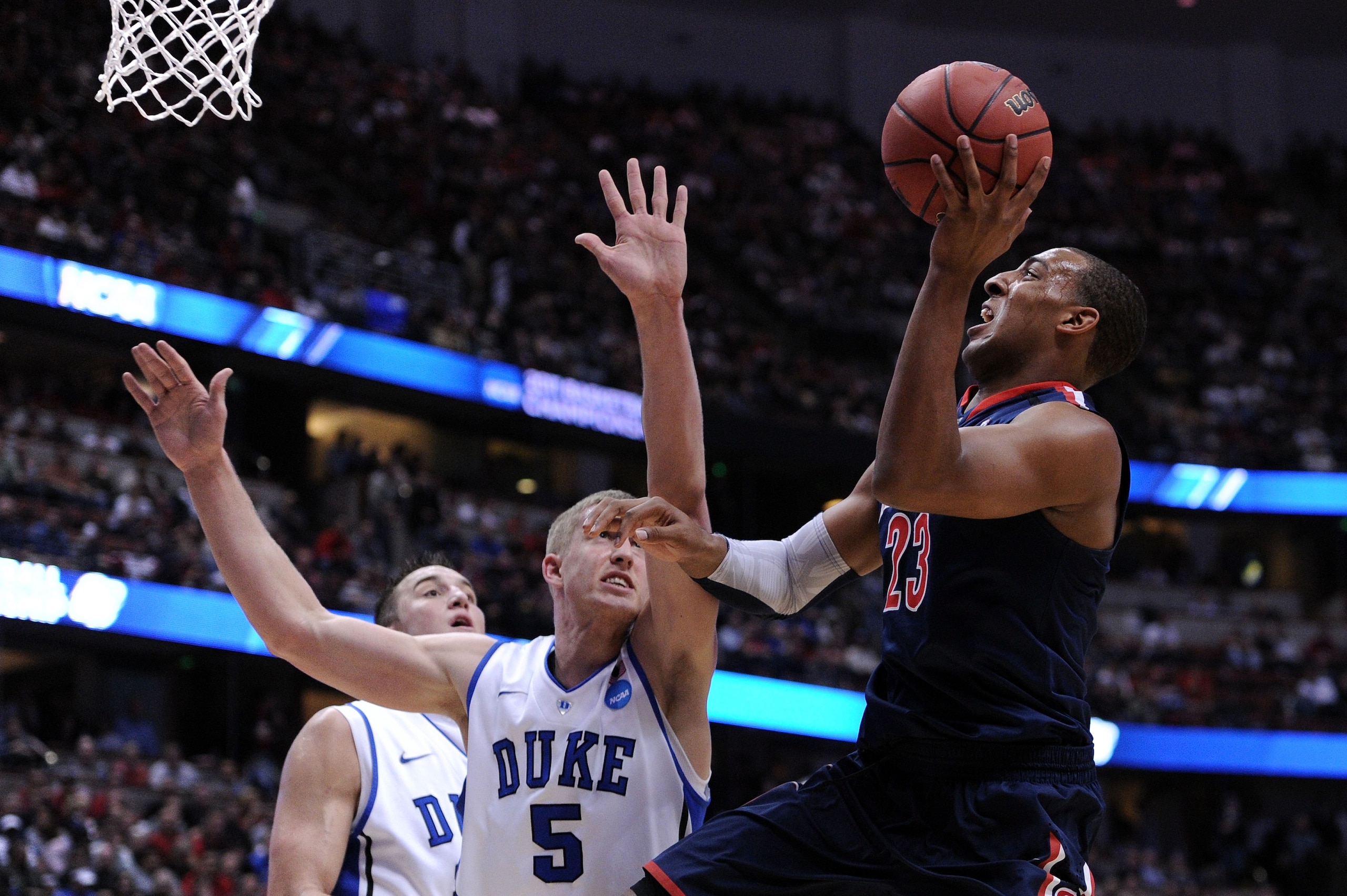 ANAHEIM, CA - MARCH 24:  Derrick Williams #23 of the Arizona Wildcats goes to the basket against Mason Plumlee #5 of the Duke Blue Devils during the west regional semifinal of the 2011 NCAA men's basketball tournament at the Honda Center on March 24, 2011