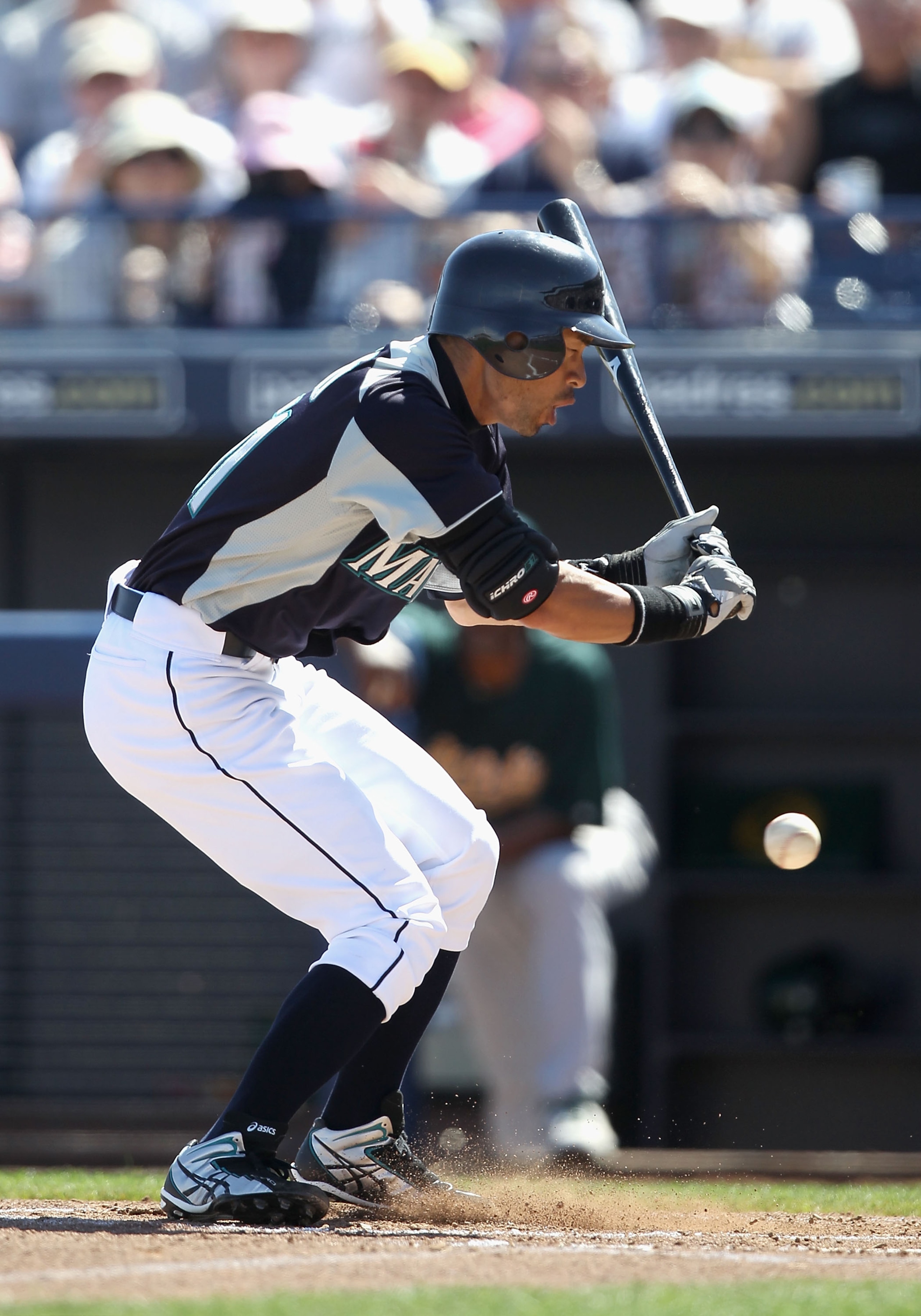PEORIA, AZ - MARCH 12:  Ichiro Suzuki #51 of the Seattle Mariners reacts as he is hit in the leg by a pitch during the first inning of the spring training game against the Oakland Athletics at Peoria Stadium on March 12, 2011 in Peoria, Arizona.  (Photo b