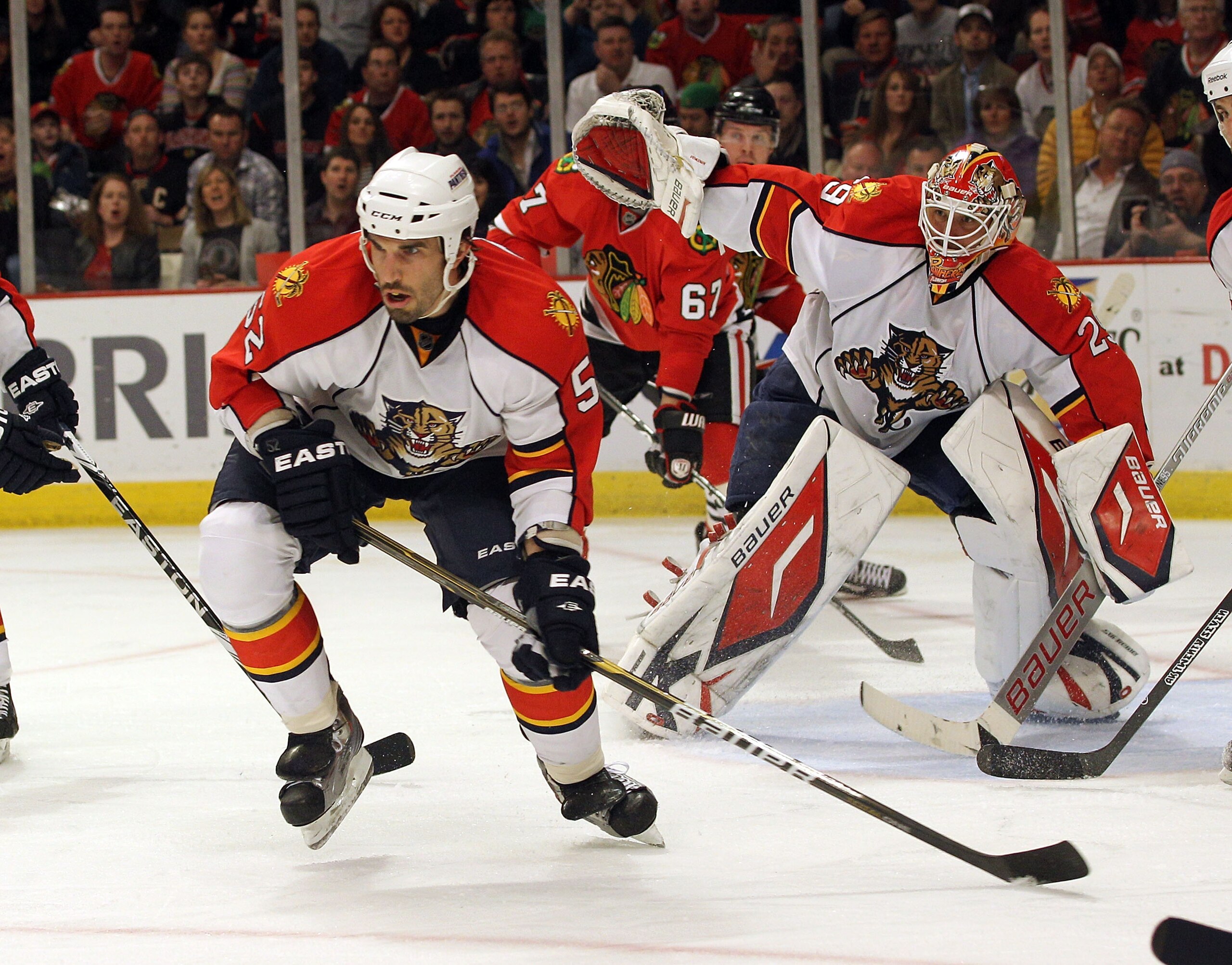 CHICAGO, IL - MARCH 23: Jason Garrison #52  and Tomas Vokoun #29 of the Florida Panthers skate against the Chicago Blackhawks at the United Center on March 23, 2011 in Chicago, Illinois. The Blackhawks defeated the Panthers 4-0.  (Photo by Bruce Bennett/G