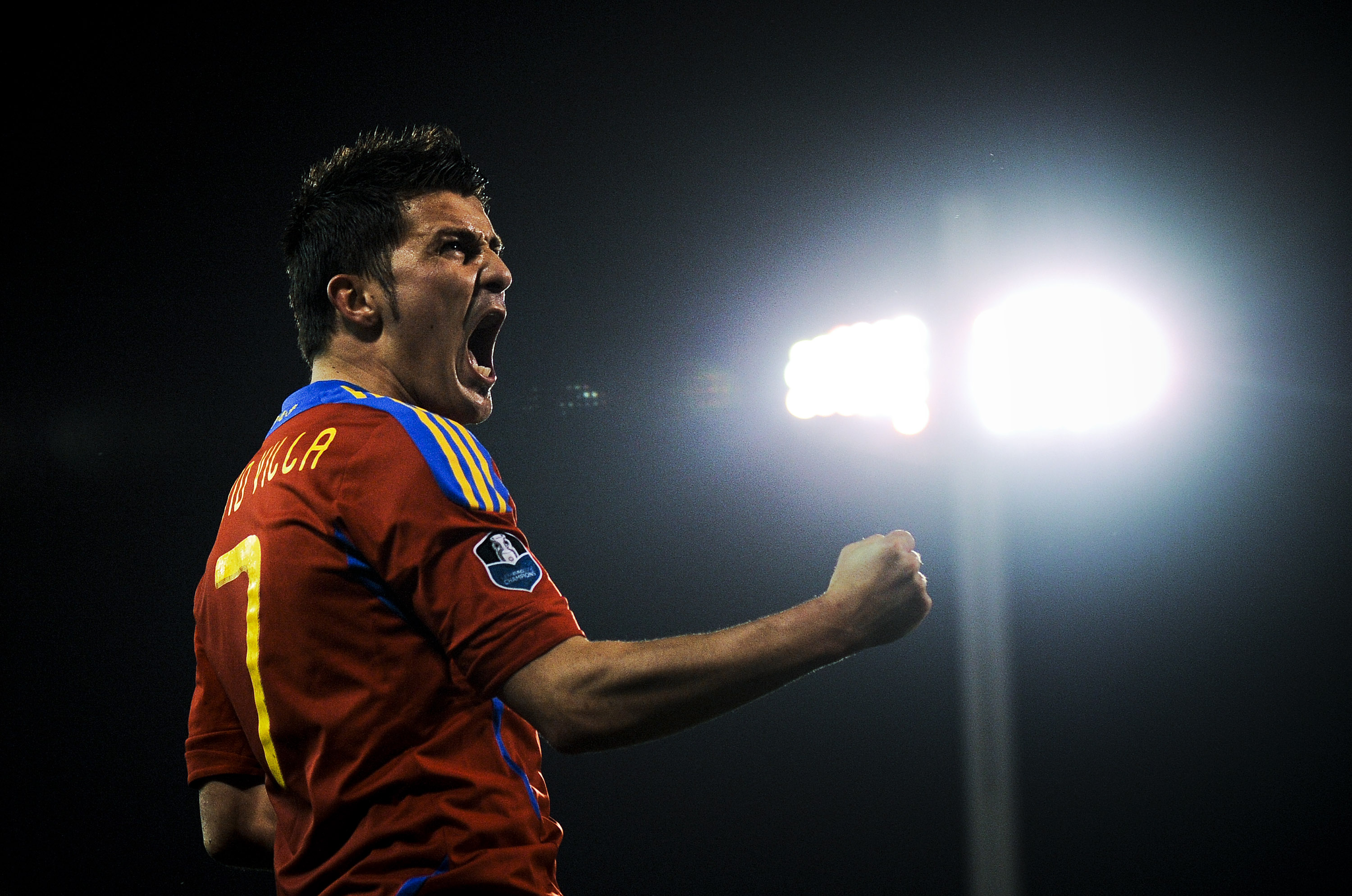 GRANADA, SPAIN - MARCH 25:  David Villa of Spain (R) celebrates after scoring his second goal during the UEFA EURO 2012 qualifier between Spain and Czech Republic at Los Carmenes Stadium on March 25, 2011 in Granada, Spain.  Spain win 2-1. (Photo by David