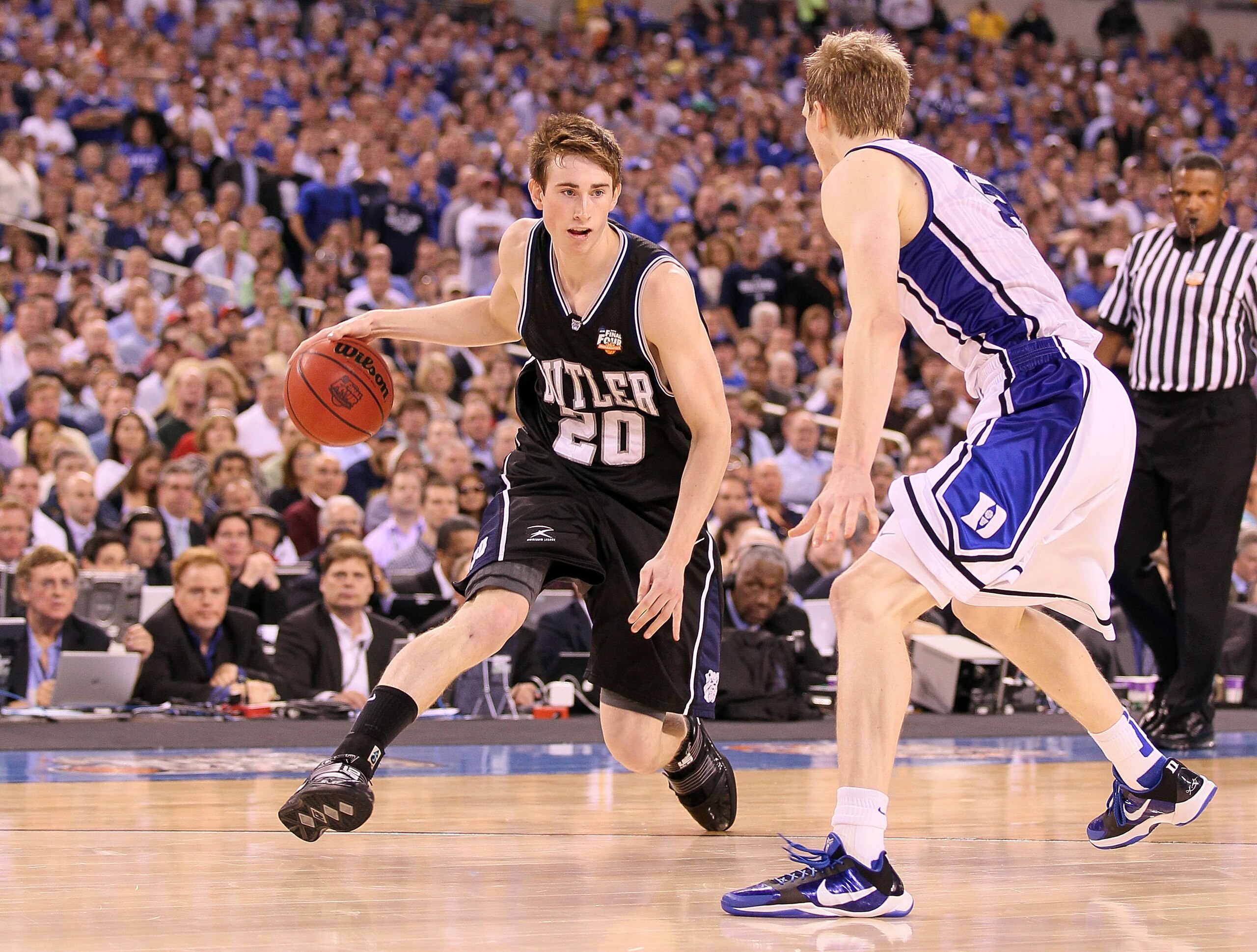 INDIANAPOLIS - APRIL 05:  Gordon Hayward #20 of the Butler Bulldogs drives against Kyle Singler #12 of the Duke Blue Devils during the 2010 NCAA Division I Men's Basketball National Championship game at Lucas Oil Stadium on April 5, 2010 in Indianapolis,