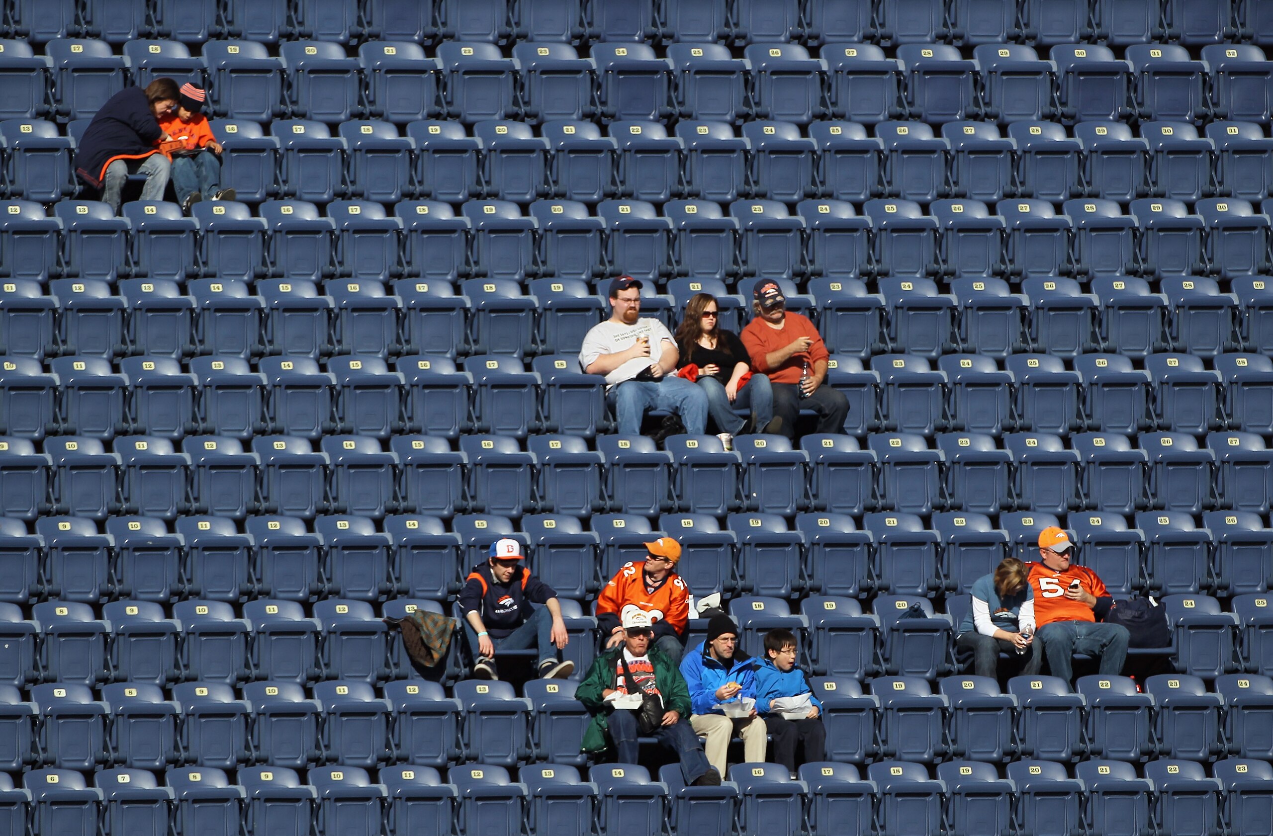 DENVER - DECEMBER 26:  Fans begin to occupy the empty seats prior to the game as the Denver Broncos host the Houston Texas at INVESCO Field at Mile High on December 26, 2010 in Denver, Colorado. The Broncos defeated the Texans 24-23.  (Photo by Doug Pensi