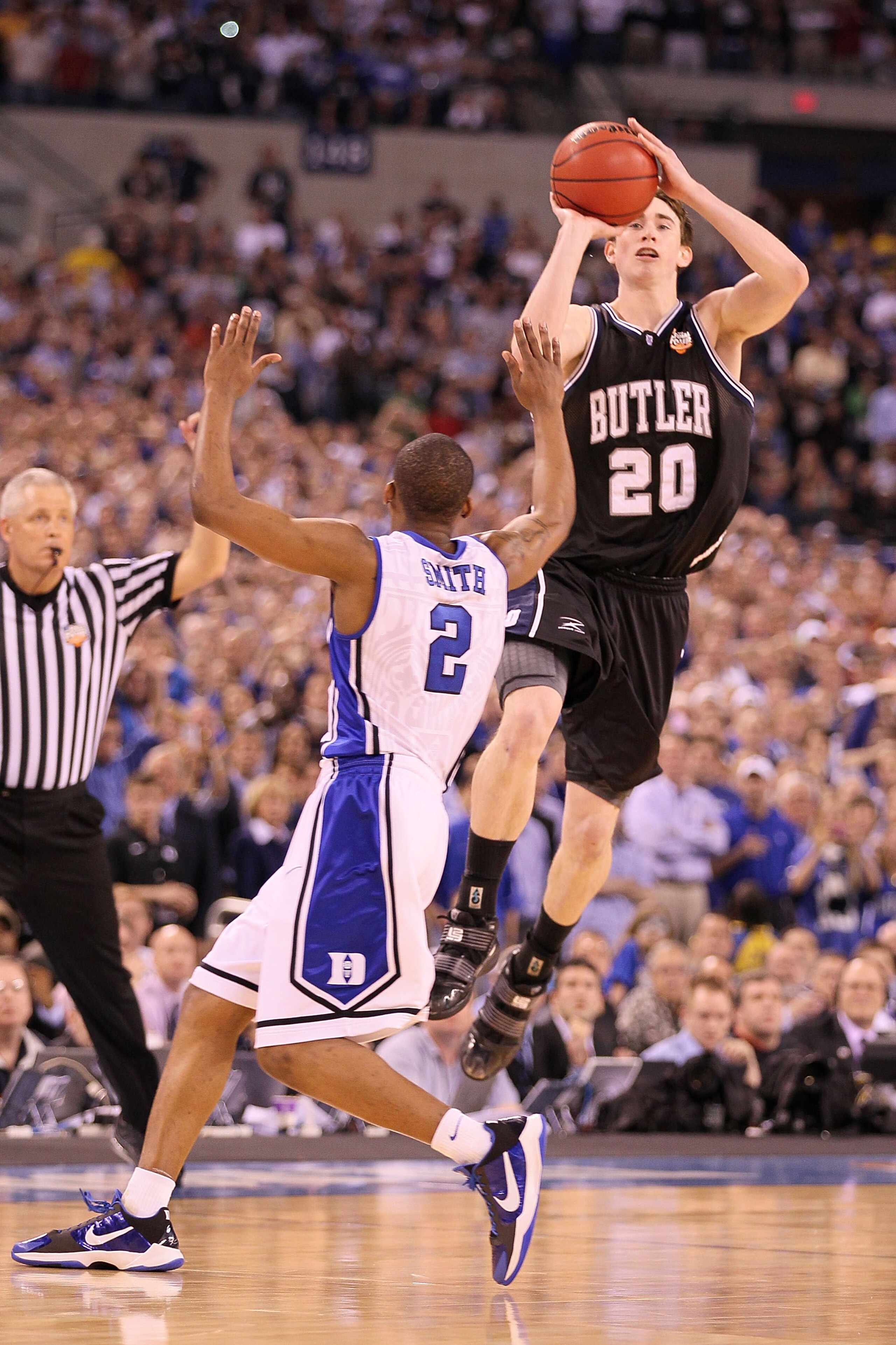 INDIANAPOLIS - APRIL 05:  Gordon Hayward #20 of the Butler Bulldogs shoots a last second shot from half court over Nolan Smith #2 of the Duke Blue Devils that missed during the 2010 NCAA Division I Men's Basketball National Championship game at Lucas Oil