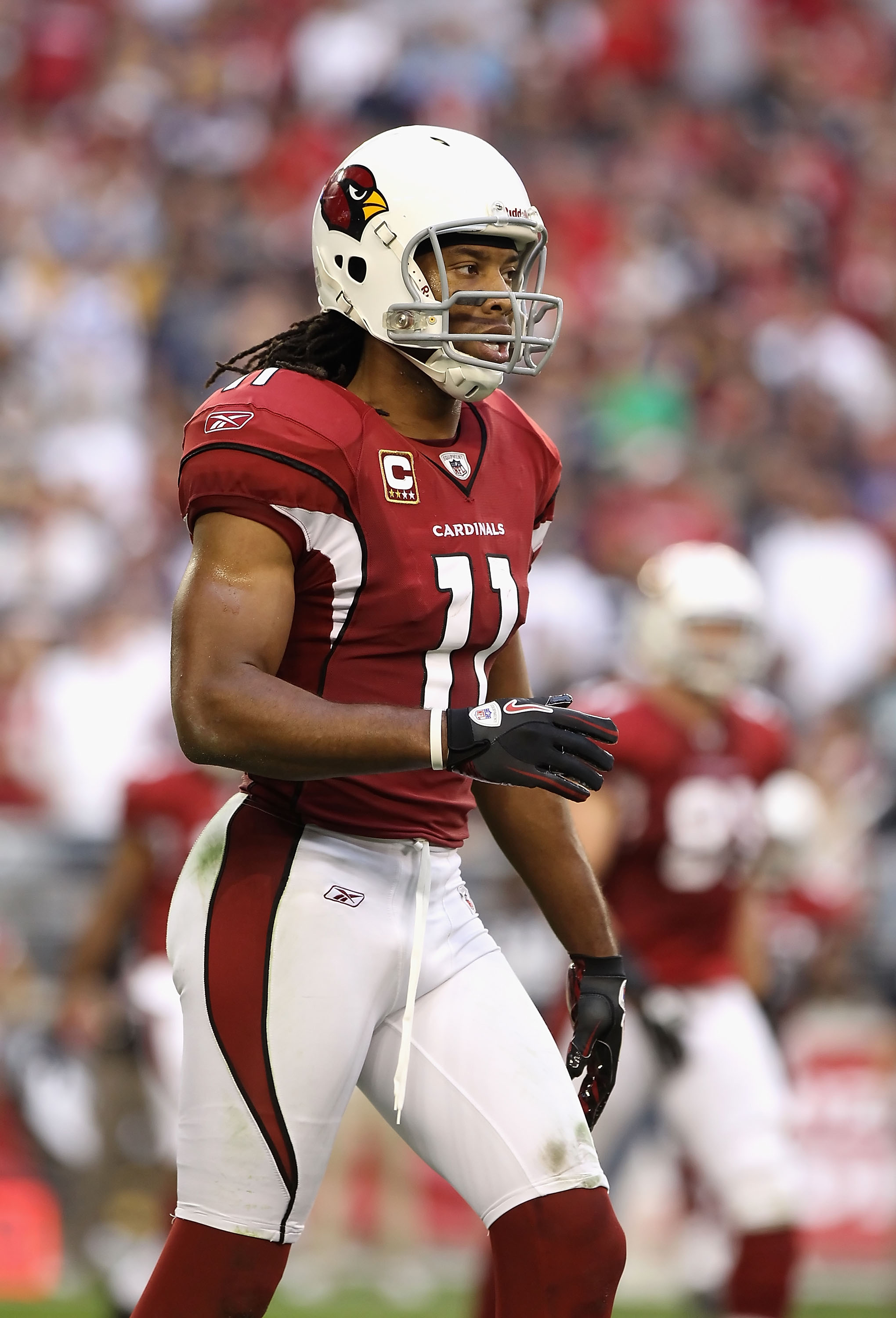 Arizona Cardinals wide receiver Larry Fitzgerald walks off the field after  turning the ball over on downs in their game against the Seattle Seahawks  on Sunday October 24, 2010 at Qwest Field