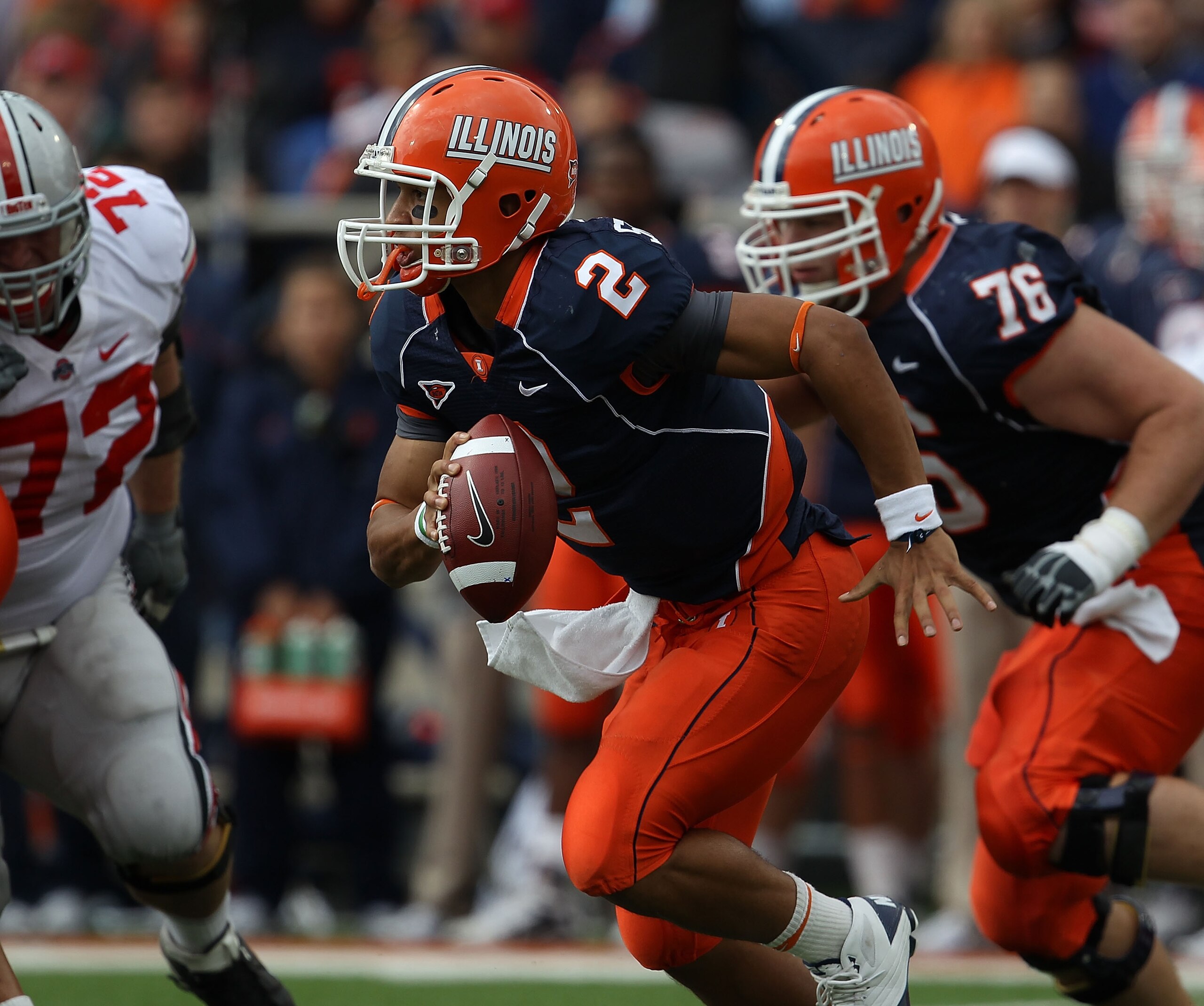 CHAMPAIGN, IL - OCTOBER 02: Nathan Scheelhaase #2 of the Illinois Fighting Illini runs against the Ohio State Buckeyes as teammate Graham Pocic #76 moves to block at Memorial Stadium on October 2, 2010 in Champaign, Illinois. Ohio State defeated Illinois