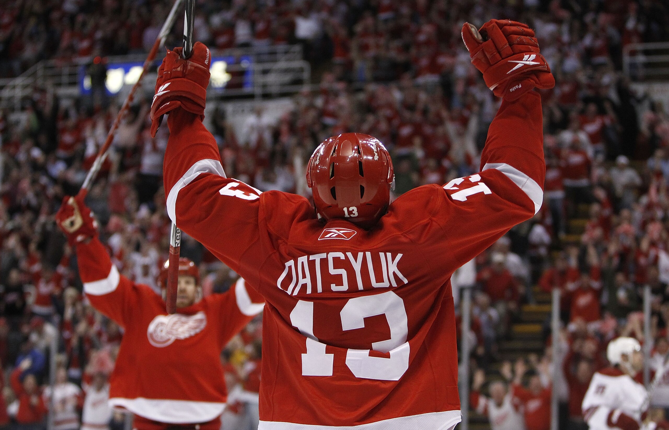DETROIT - APRIL 20:  Pavel Datsyuk #13 of the Detroit Red Wings celebrates his third-period goal with Johan Franzen #93 while playing the Phoenix Coyotes in Game Four of the Western Conference Quarterfinals of the 2010 NHL Stanley Cup Playoffs on April 20