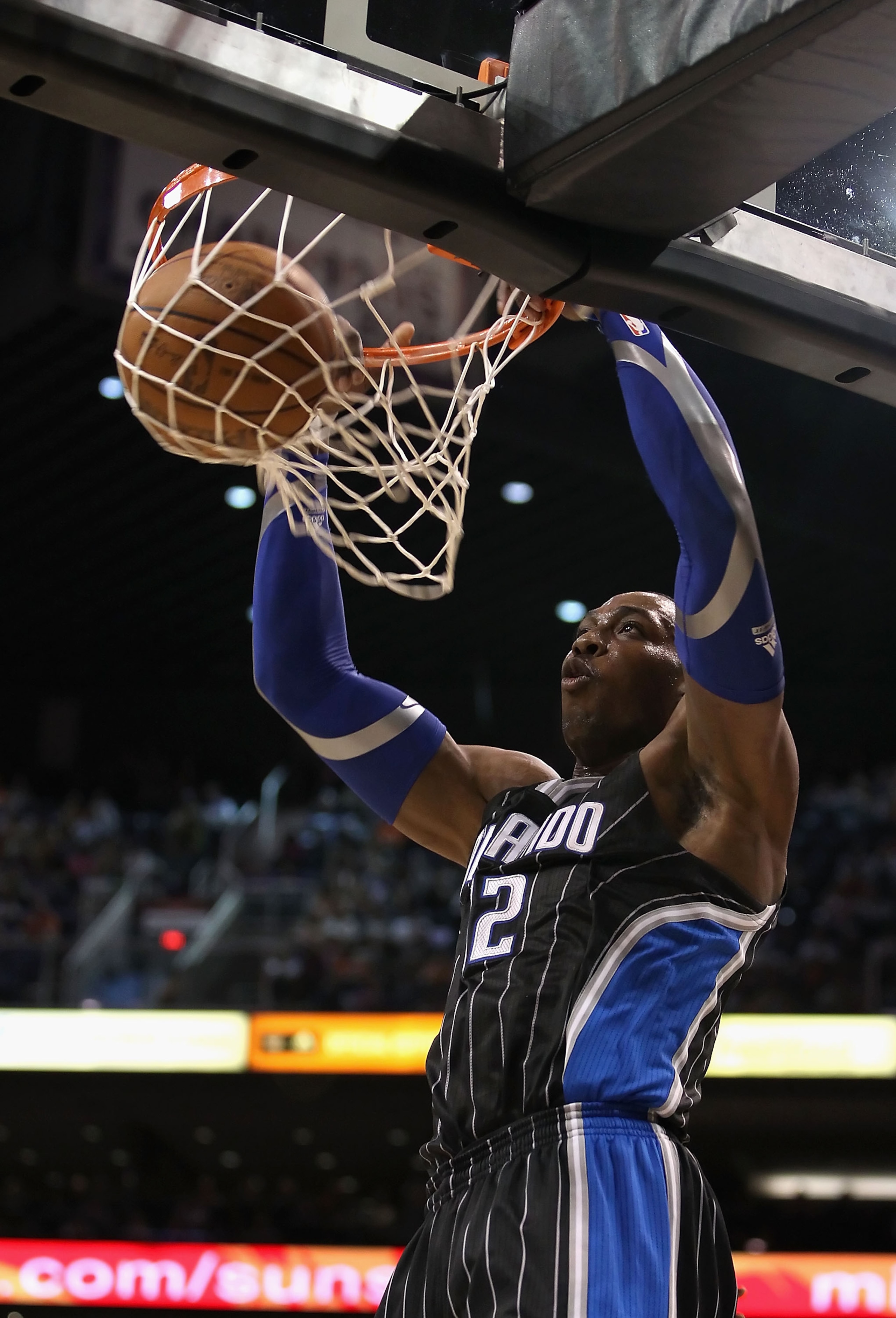 PHOENIX, AZ - MARCH 13: Dwight Howard #12 of the Orlando Magic slam dunks the ball against the Phoenix Suns during the NBA game at US Airways Center on March 13, 2011 in Phoenix, Arizona. NOTE TO USER: User expressly acknowledges and agrees that, by dow PHOENIX, AZ - MARCH 13: Dwight Howard #12 of the Orlando Magic slam dunks the ball against the Phoenix Suns during the NBA game at US Airways Center on March 13, 2011 in Phoenix, Arizona. NOTE TO USER: User expressly acknowledges and agrees that, by dow
