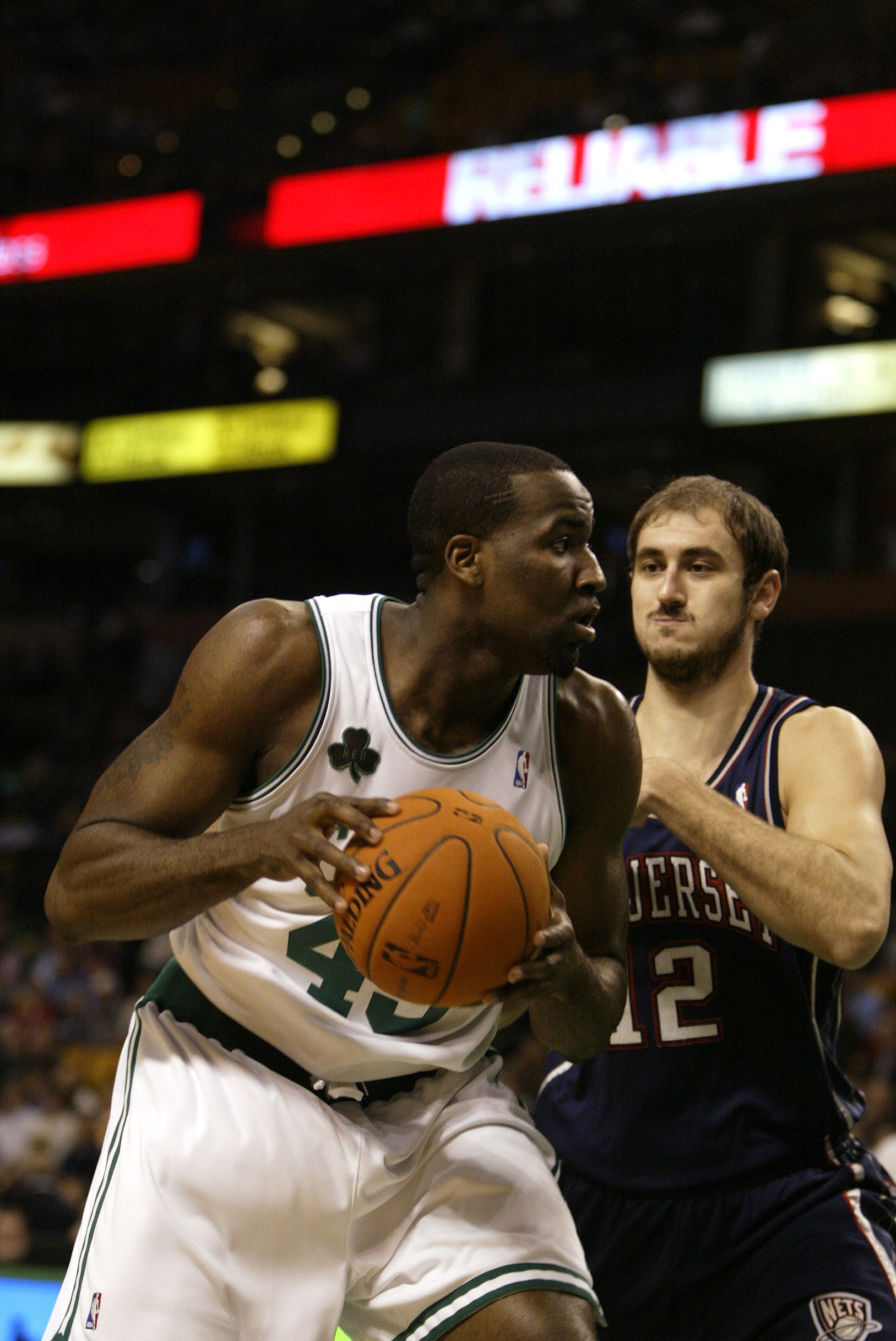 BOSTON - NOVEMBER 29:  Kendrick Perkins #43 of the Boston Celtics is defended by Nenad Krstic #12 of the New Jersey Nets on November 29, 2006 at the TD Banknorth Garden in Boston, Massachusetts. The Nets defeated the Celtics, 106-103. NOTE TO USER: User e