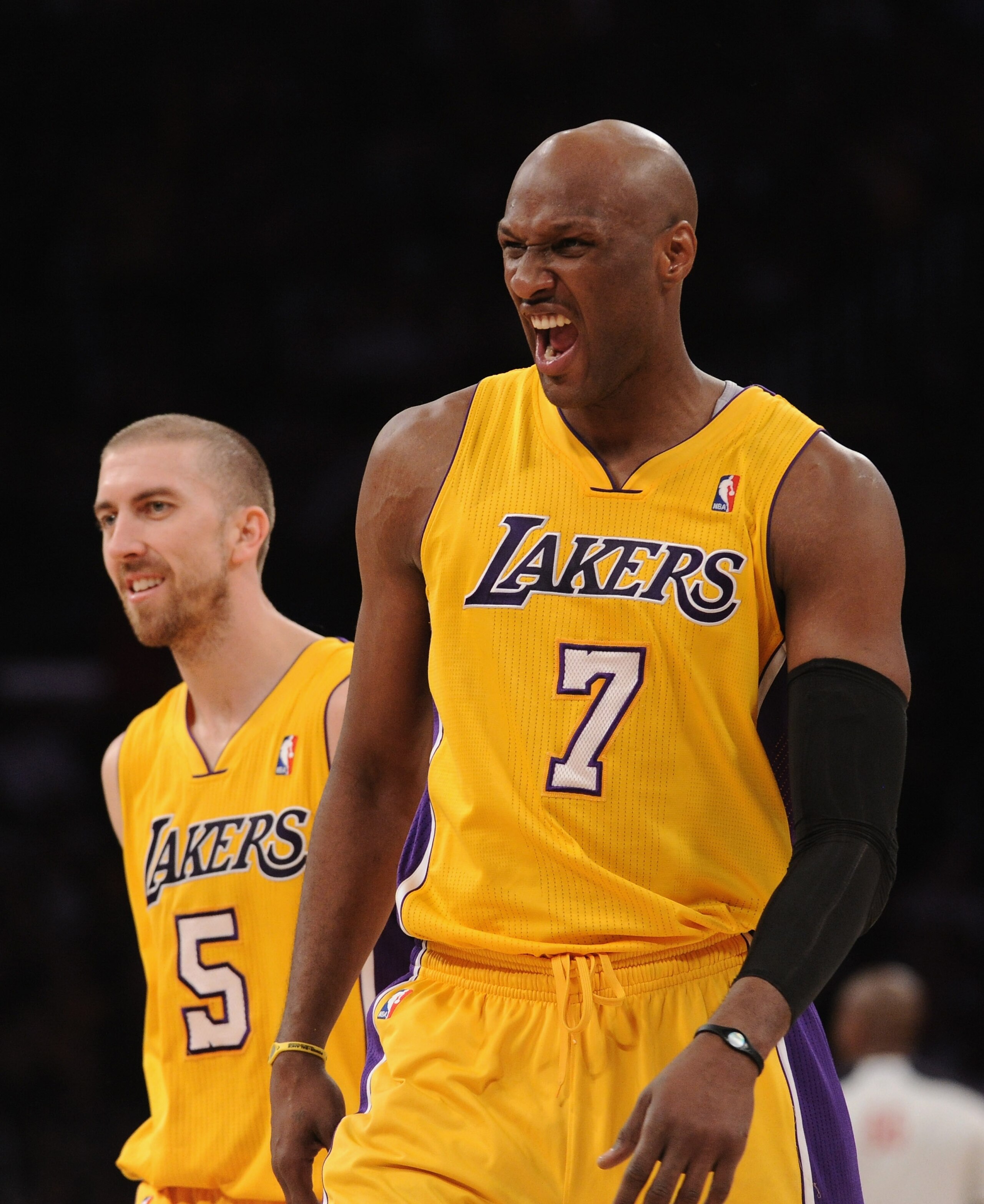 LOS ANGELES, CA - MARCH 31:  Lamar Odom #7 of the Los Angeles Lakers reacts after his third consecutive three pointer with Steve Blake #5 during a 110-82 win over the Dallas Mavericks at Staples Center on March 31, 2011 in Los Angeles, California.  NOTE T