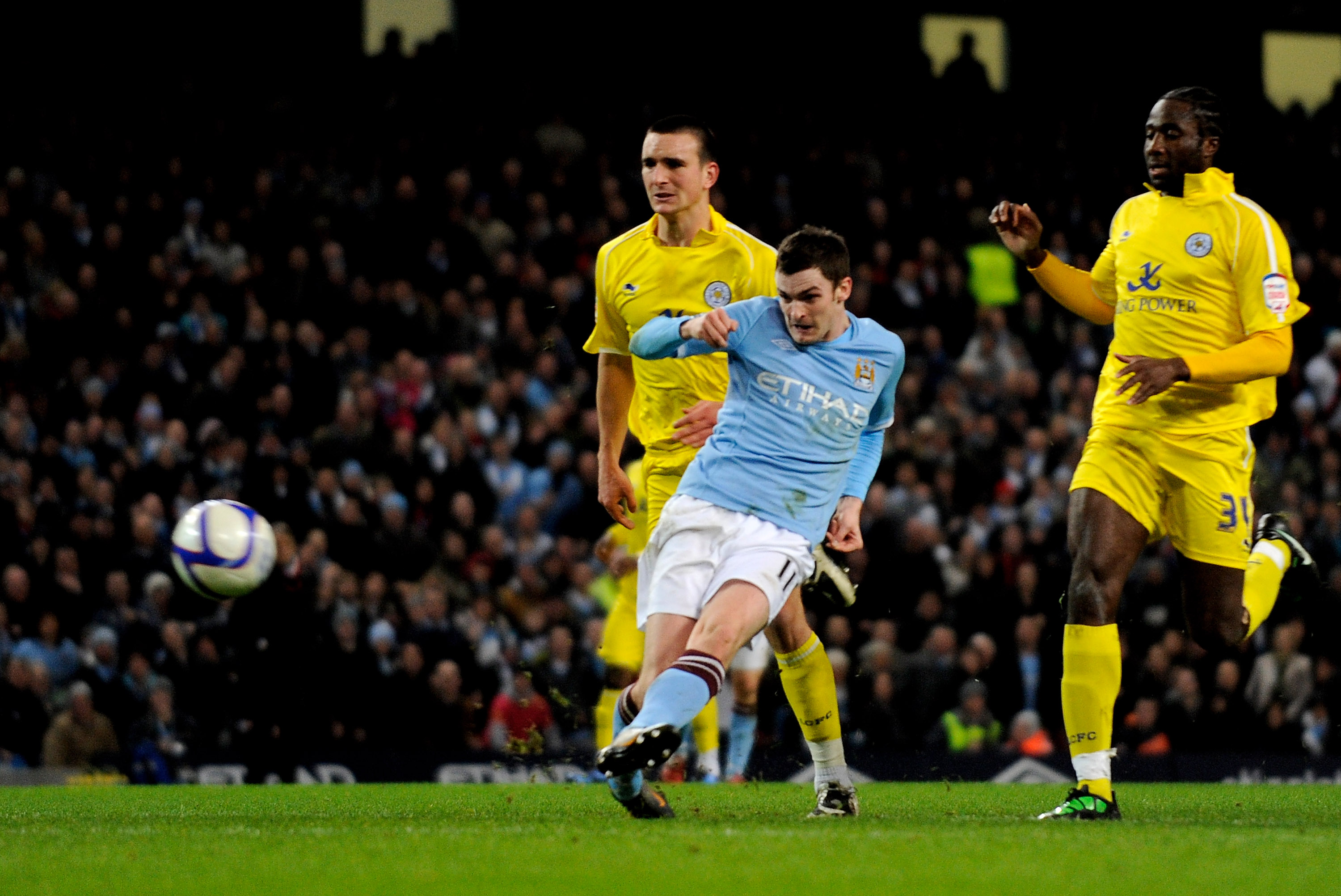 MANCHESTER, ENGLAND - JANUARY 18:  Adam Johnson of Manchester City scores his team's third goal during the FA Cup sponsored by E.On Third Round Replay match between Manchester City and Leicester City at the City of Manchester Stadium on January 18, 2011 i