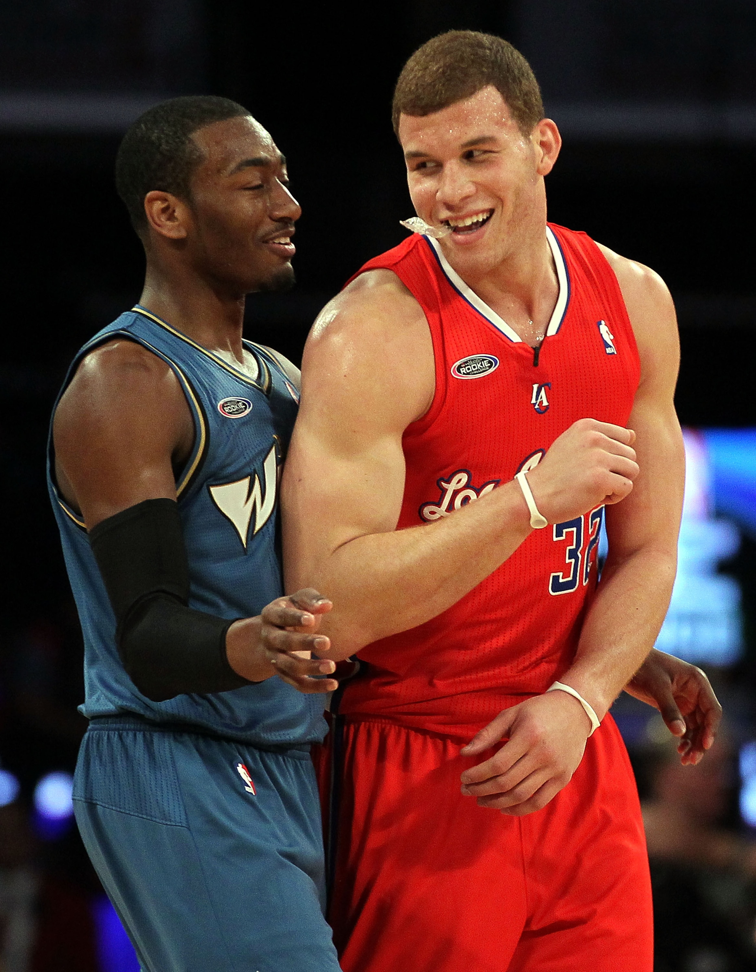 LOS ANGELES, CA - FEBRUARY 18:  John Wall #2 of the Washington Wizards and the Rookie Team and Blake Griffin #32 of the Los Angeles Clippers and the Rookie Team laugh on the court in the second half during the T-Mobile Rookie Challenge and Youth Jam at St
