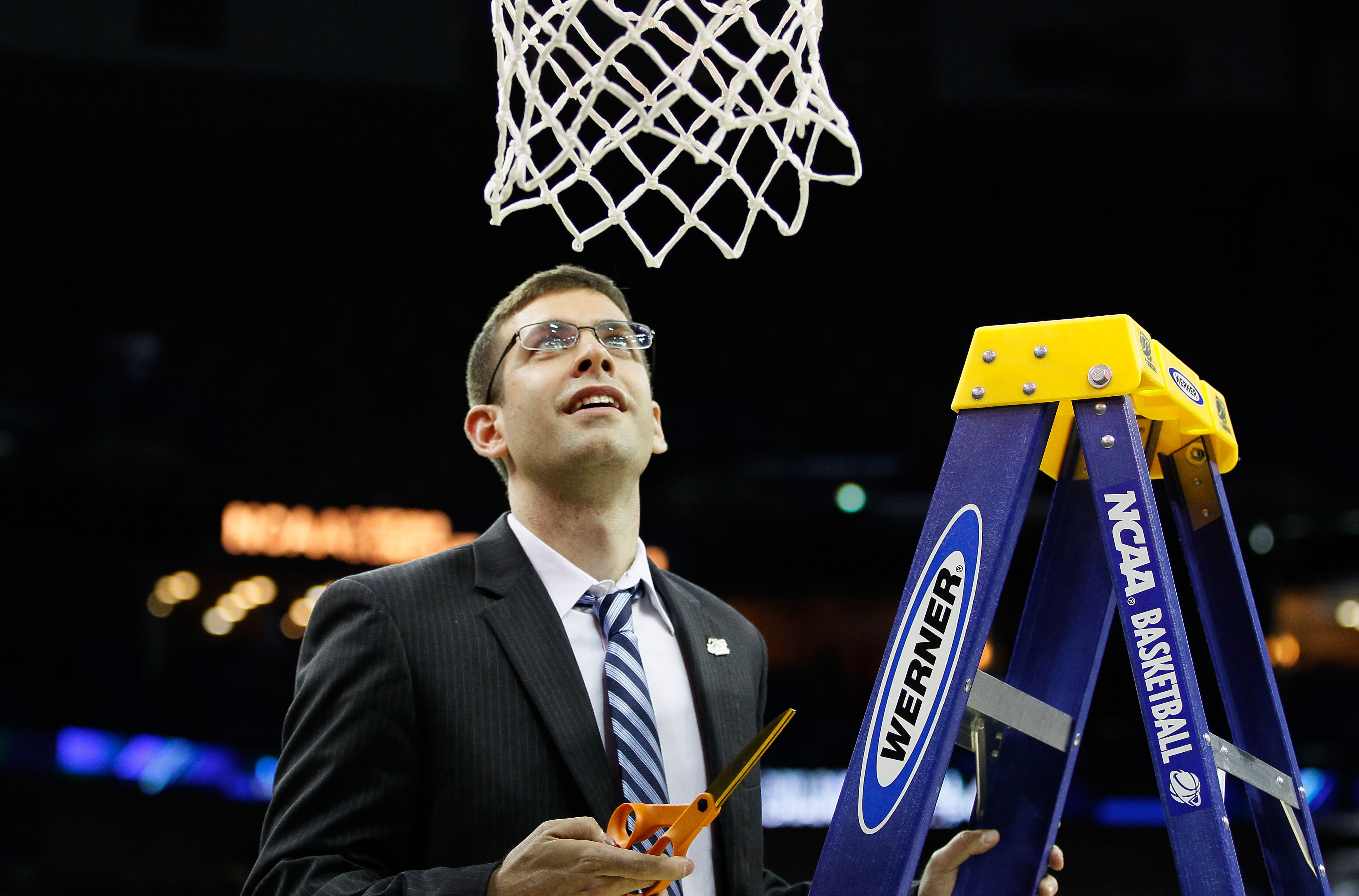 NEW ORLEANS, LA - MARCH 26: Head coach Brad Stevens of the Butler Bulldogs celebrates defeateing the Florida Gators 74 to 71 in overtime by cuttin down part of the net during the Southeast regional final of the 2011 NCAA men's basketball tournament at Ne