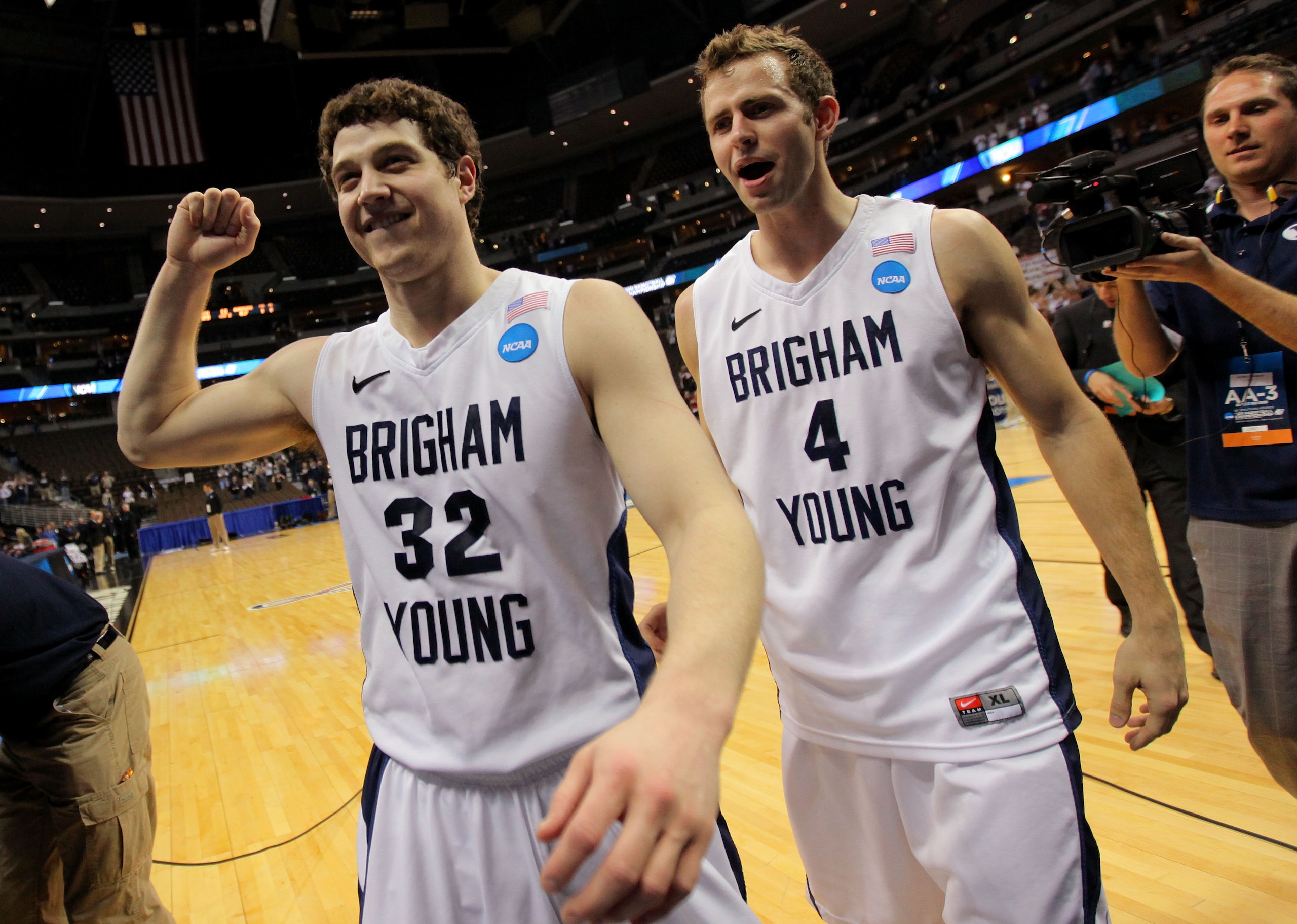 DENVER, CO - MARCH 19:  Jimmer Fredette #32 and Jackson Emery #4 of the Brigham Young Cougars walk off of the court after defeating the Gonzaga Bulldogs during the third round of the 2011 NCAA men's basketball tournament at Pepsi Center on March 19, 2011