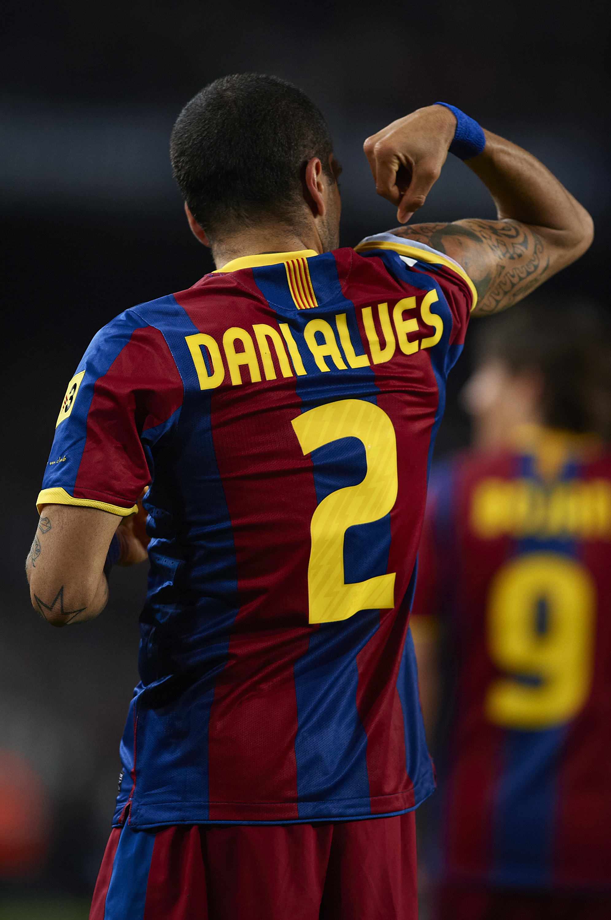 BARCELONA, SPAIN - MARCH 19:  Daniel Alves of Barcelona celebrates after scoring the opening goal during the La Liga match between Barcelona and Getafe at Camp Nou on March 19, 2011 in Barcelona, Spain.  (Photo by Manuel Queimadelos Alonso/Getty Images)