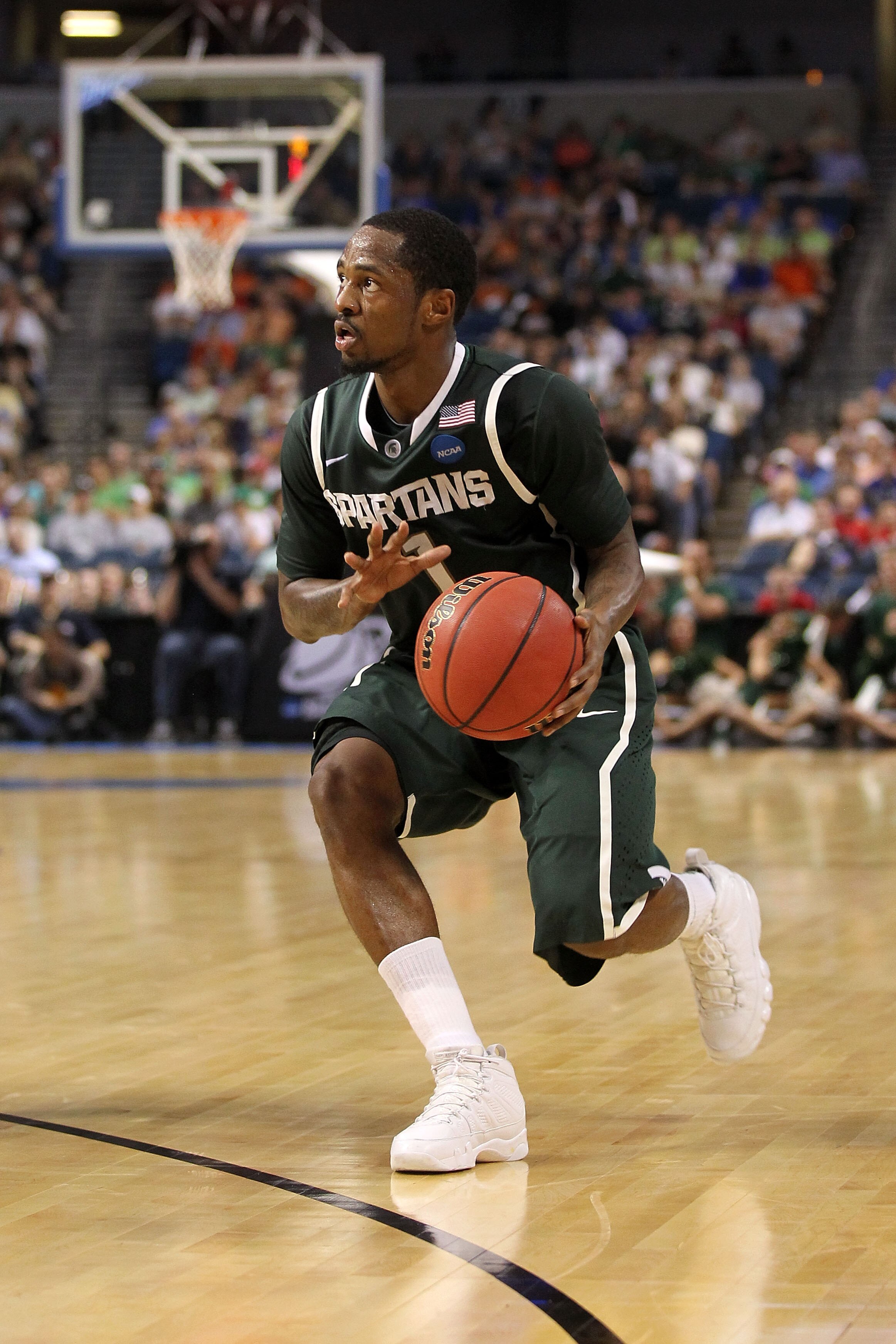 TAMPA, FL - MARCH 17:  Kalin Lucas #1 of the Michigan State Spartans drives against the UCLA Bruins during the second round of the 2011 NCAA men's basketball tournament at St. Pete Times Forum on March 17, 2011 in Tampa, Florida. UCLA won 78-76. (Photo by