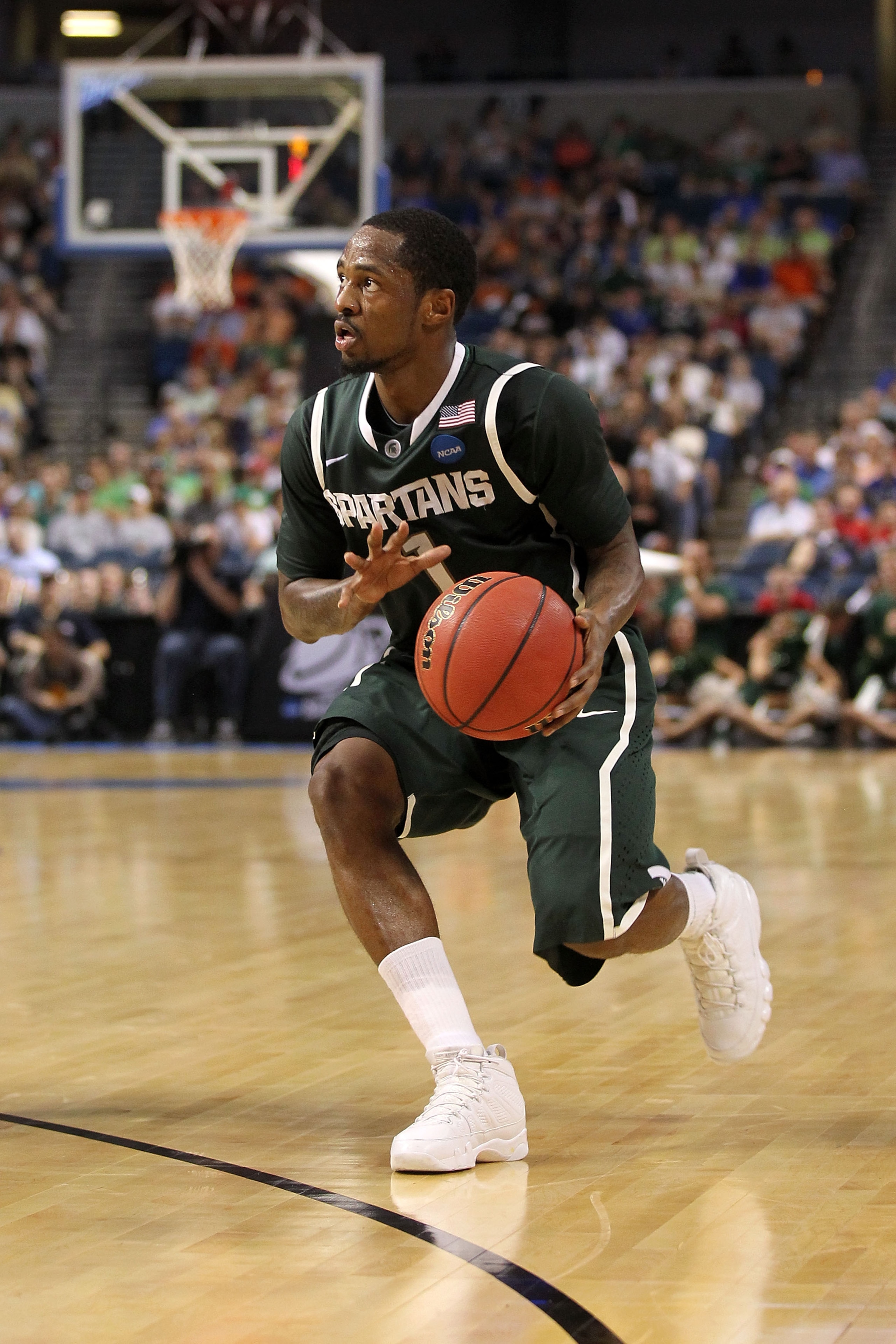 TAMPA, FL - MARCH 17:  Kalin Lucas #1 of the Michigan State Spartans drives against the UCLA Bruins during the second round of the 2011 NCAA men's basketball tournament at St. Pete Times Forum on March 17, 2011 in Tampa, Florida. UCLA won 78-76. (Photo by