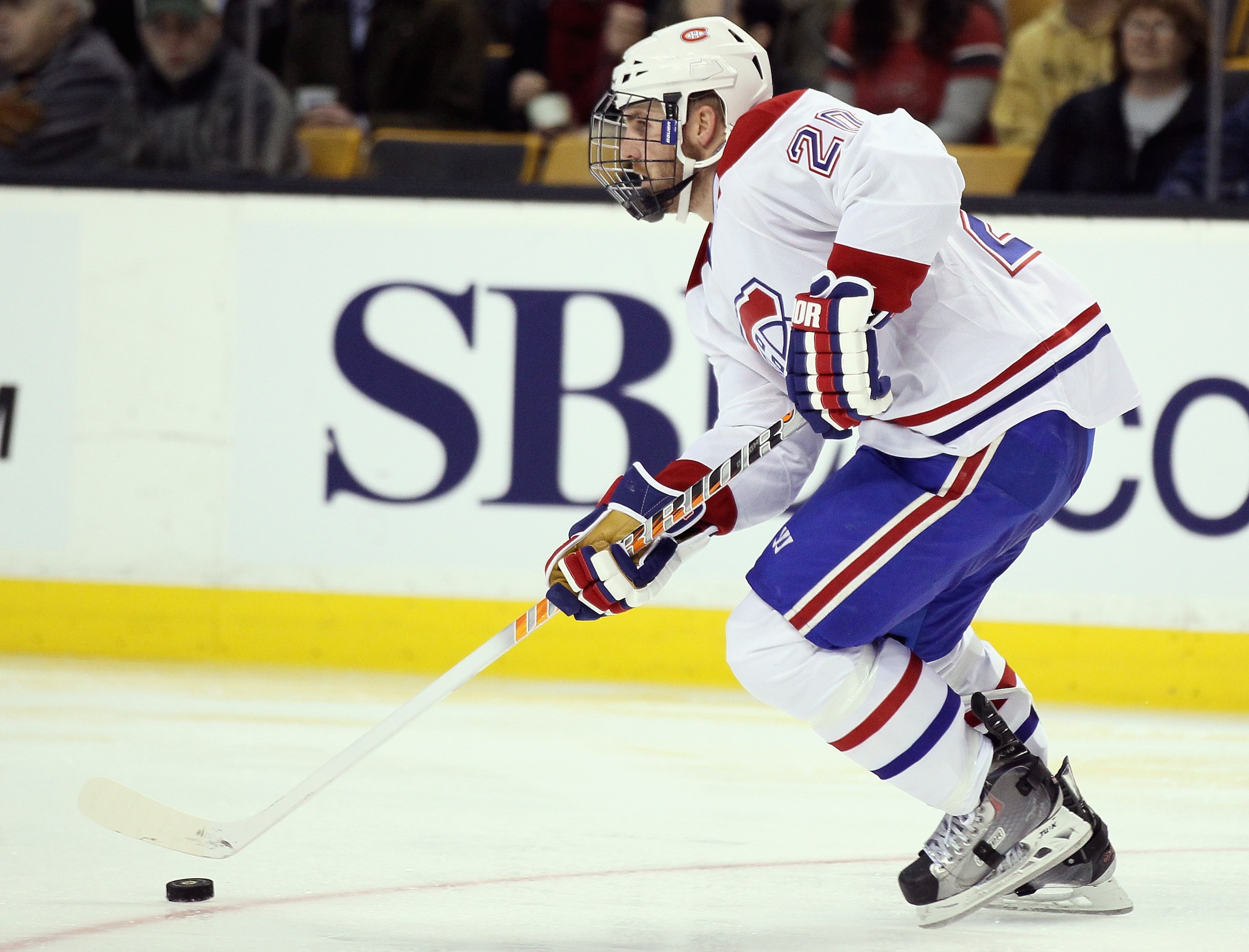 BOSTON, MA - MARCH 24:  James Wisniewski #20 of the Montreal Canadiens takes the puck in the third period against the Boston Bruins on March 24, 2011 at the TD Garden in Boston, Massachusetts.  The Boston Bruins defeated the Montreal Canadiens 7-0.  (Phot