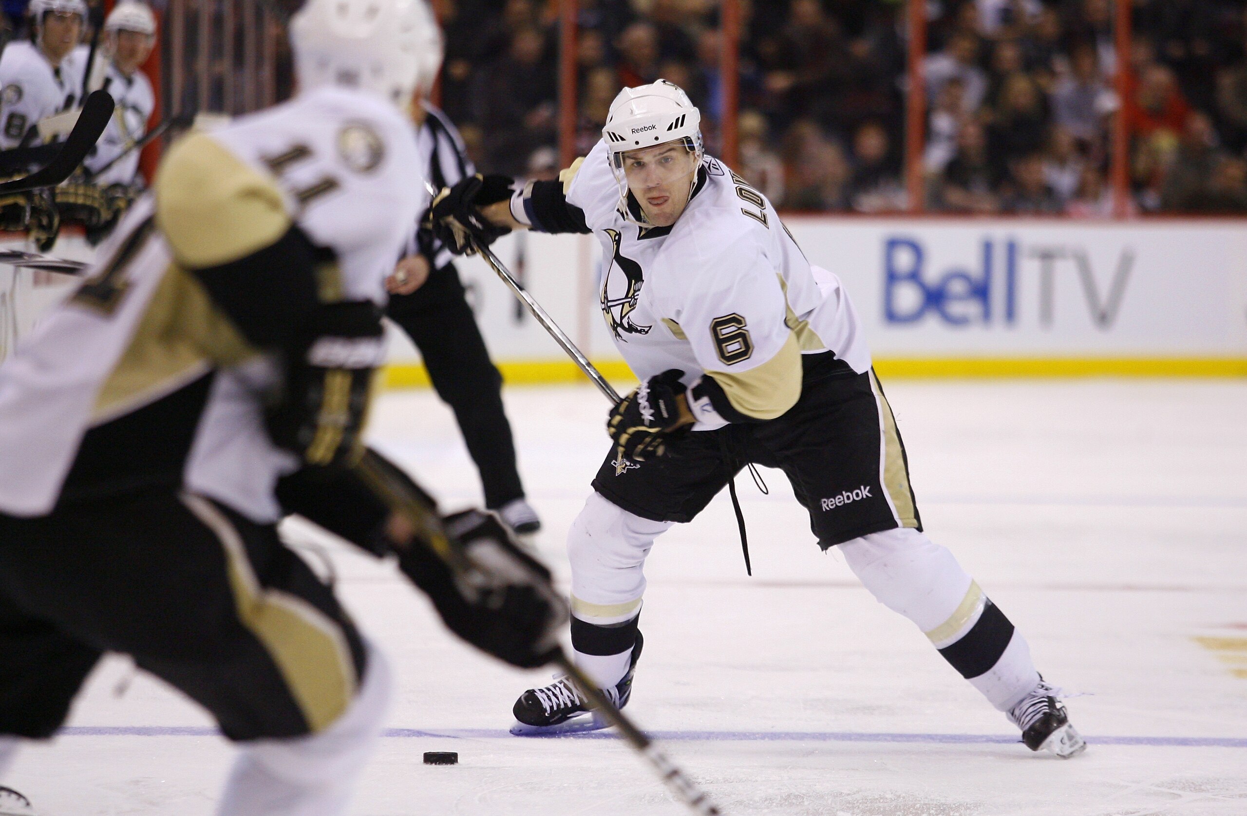OTTAWA, CANADA - MARCH 15:  Jordan Staal #11 of the Pittsburgh Penguins looks on as teammate Ben Lovejoy #6 prepares to take a slapshot from the point in a game against the Ottawa Senators at Scotiabank Place on March 15, 2011 in Ottawa, Canada.  (Photo b