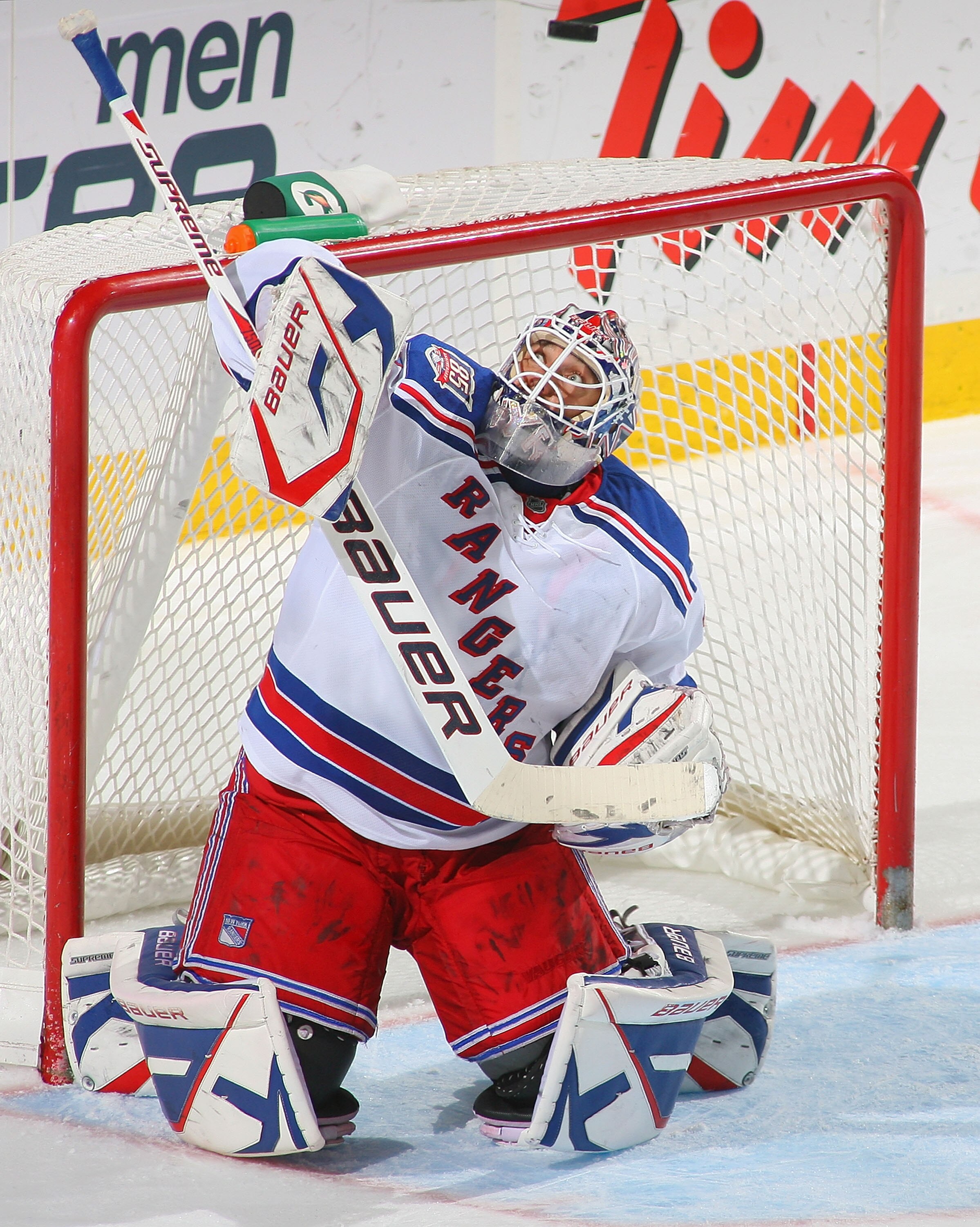 BUFFALO, NY - MARCH 30: Henrik Lundqvist #30 of the New York Rangers deflects the puck over his head against the Buffalo Sabres at HSBC Arena on March 30, 2011 in Buffalo, New York.  (Photo by Rick Stewart/Getty Images)