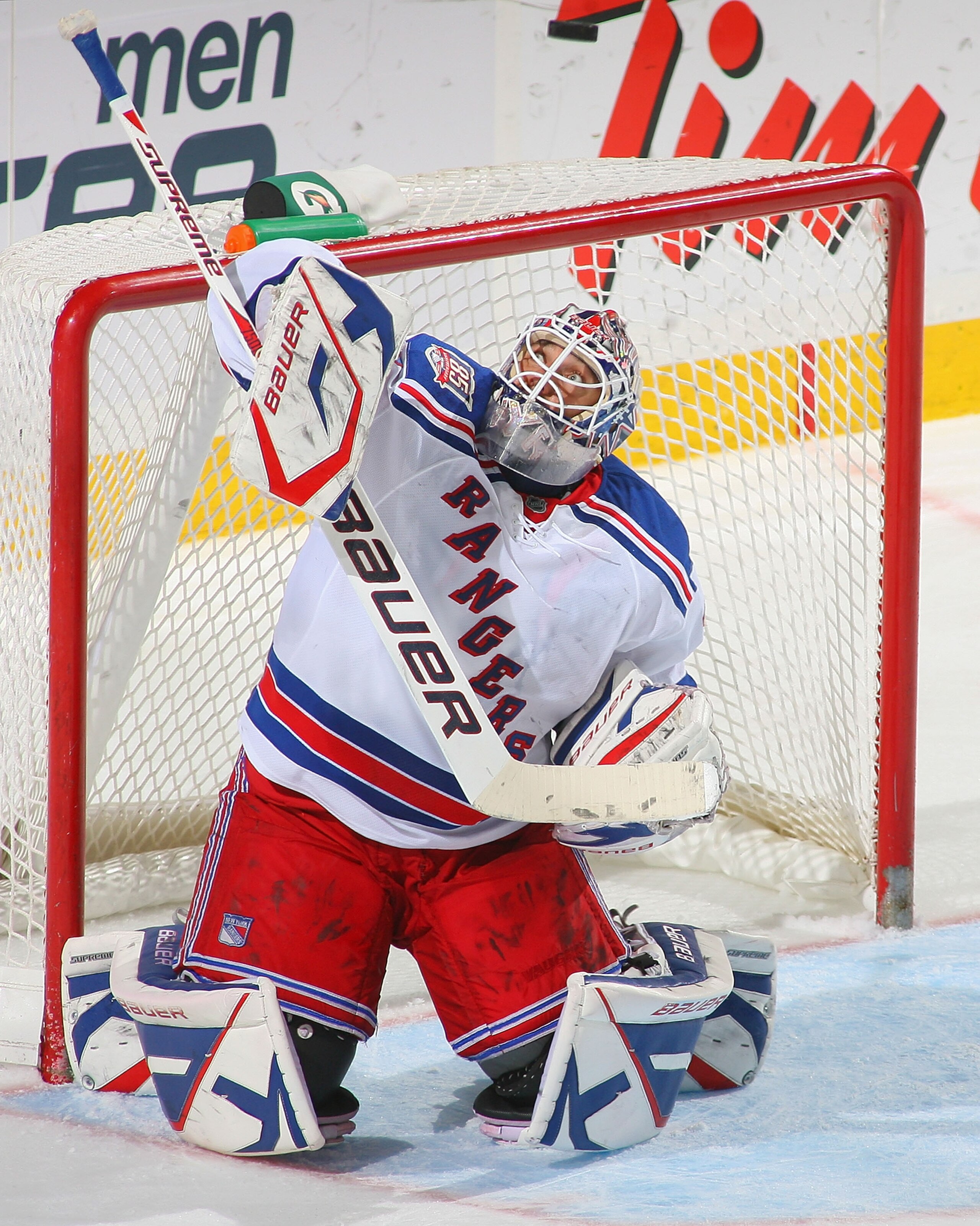 BUFFALO, NY - MARCH 30: Henrik Lundqvist #30 of the New York Rangers deflects the puck over his head against the Buffalo Sabres at HSBC Arena on March 30, 2011 in Buffalo, New York.  (Photo by Rick Stewart/Getty Images)