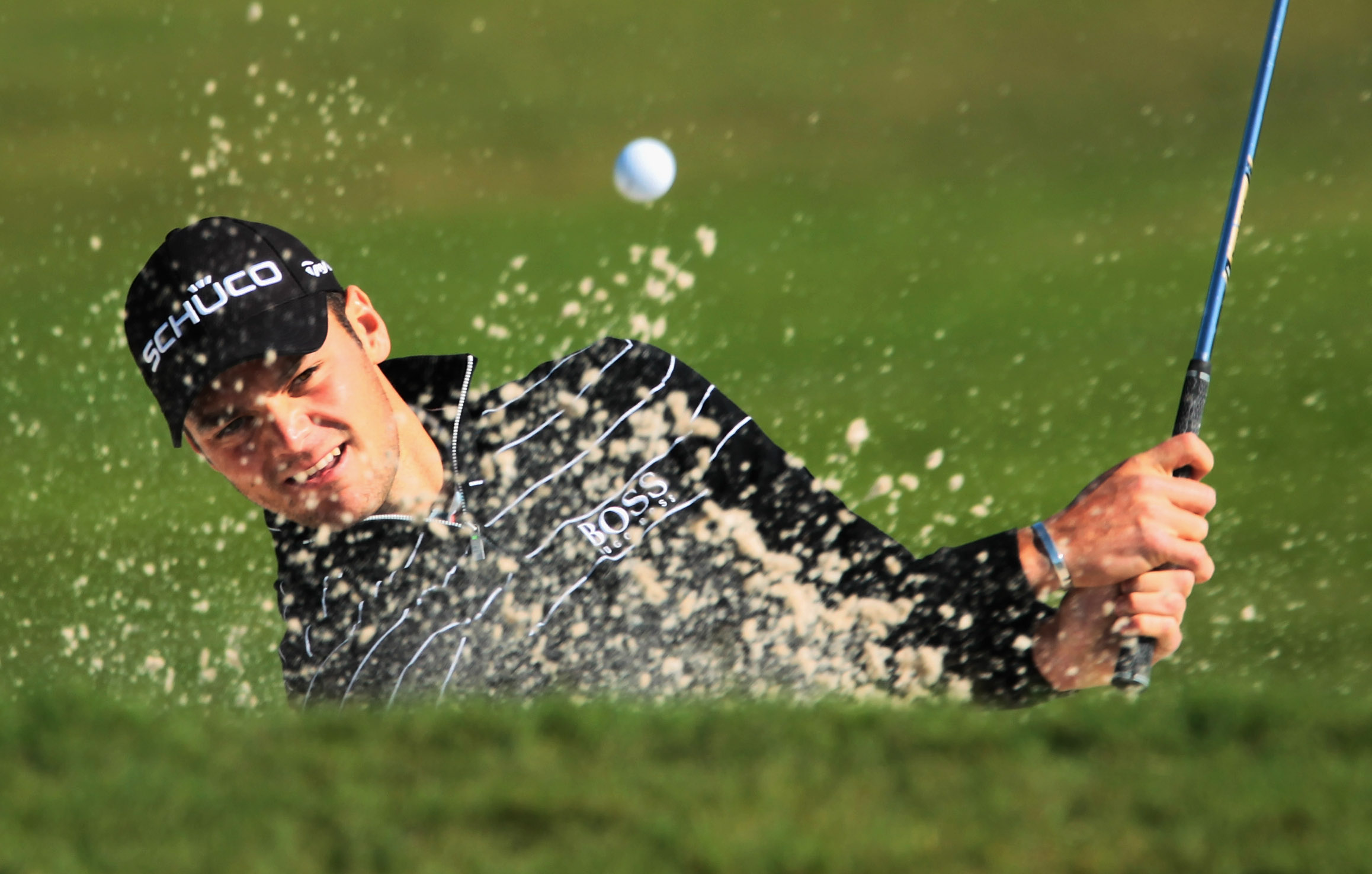 DORAL, FL - MARCH 11:  Martin Kaymer of Germany plays a bunker shot on the 15th hole during the completion of the first round of the 2011 WGC- Cadillac Championship at the TPC Blue Monster at the Doral Golf Resort and Spa on March 11, 2011 in Doral, Flori