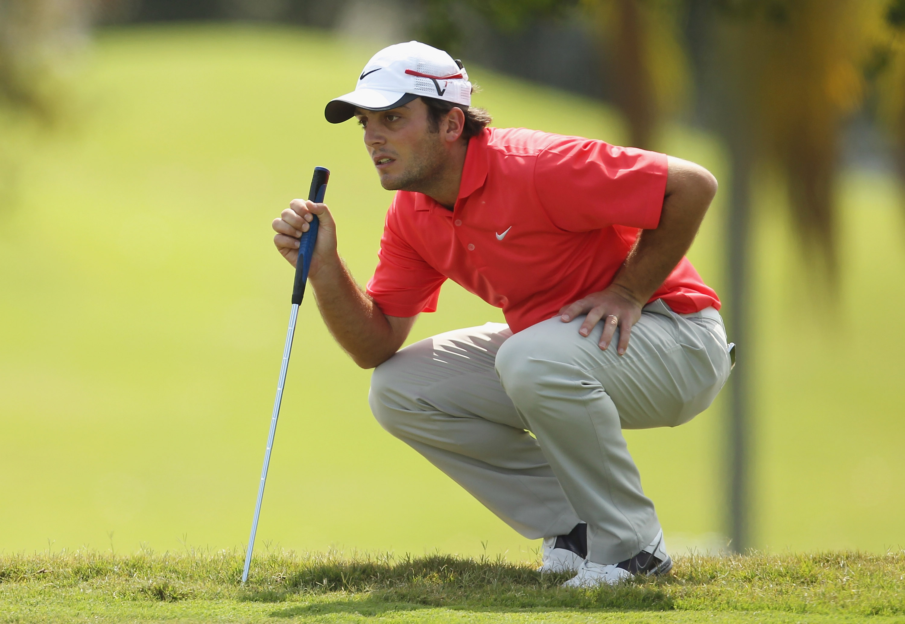 DORAL, FL - MARCH 12:  Francesco Molinari of Italy lines up a putt on the first hole during the third round of the 2011 WGC- Cadillac Championship at the TPC Blue Monster at the Doral Golf Resort and Spa on March 12, 2011 in Doral, Florida.  (Photo by Mik