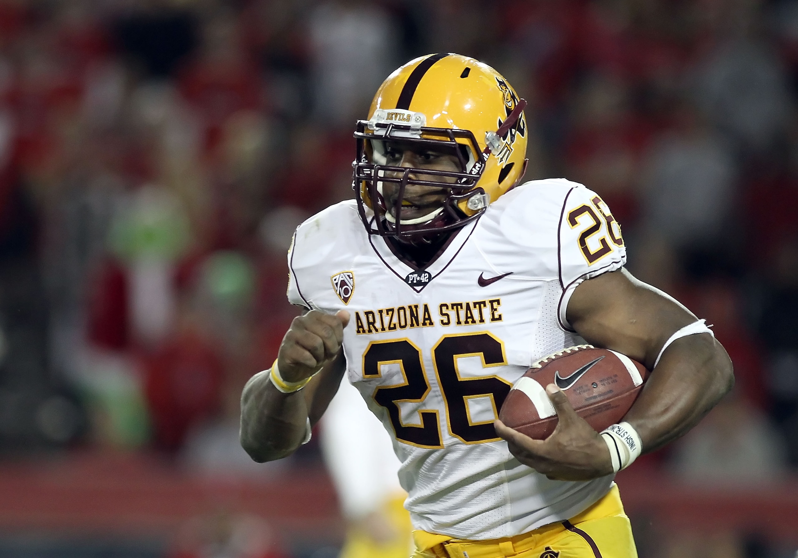 TUCSON, AZ - DECEMBER 02:  Runningback Cameron Marshall #26 of the Arizona State Sun Devils runs with the football during the college football game at Arizona Stadium on December 2, 2010 in Tucson, Arizona. The Sun Devils defeated the Wildcats 30-29 in do