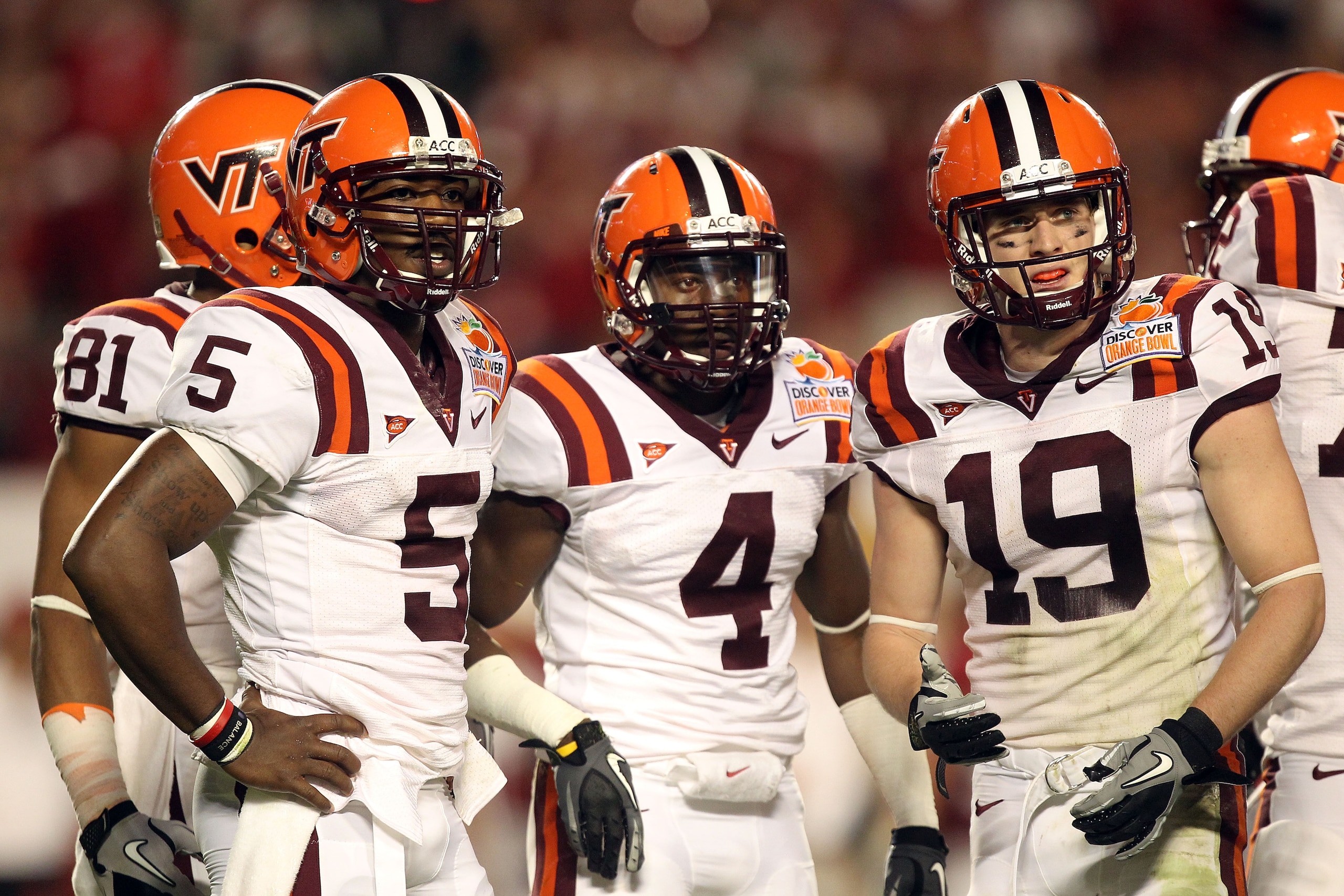 MIAMI, FL - JANUARY 03:  (L-R) Tyrod Taylor #5, David Wilson #4 and Danny Coale #19 of the Virginia Tech Hokies look towards the sideline against the Stanford Cardinal during the 2011 Discover Orange Bowl at Sun Life Stadium on January 3, 2011 in Miami, F