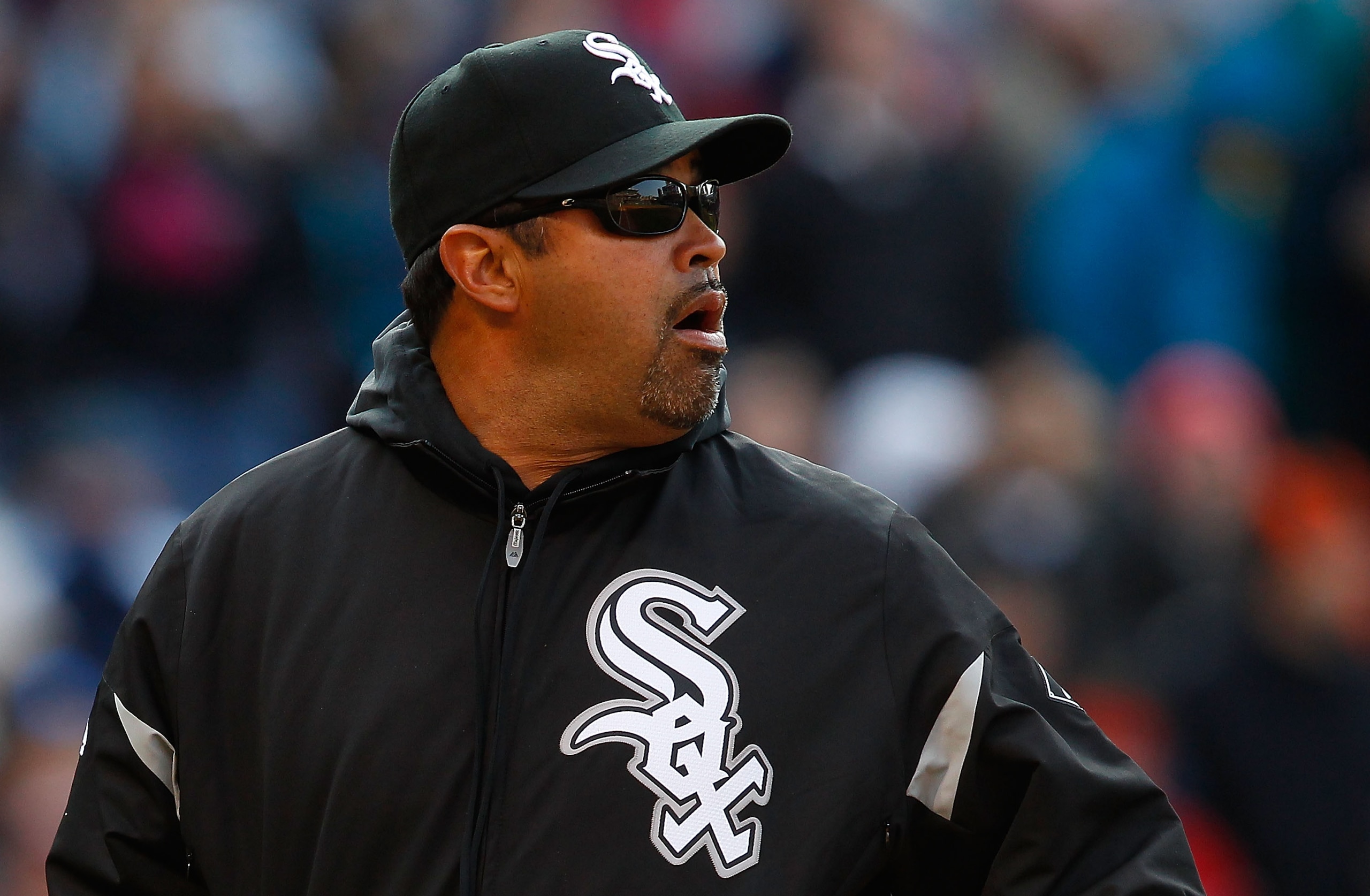 CLEVELAND - APRIL 01:  Manager Ozzie Guillen #13 of the Chicago White Sox walks to the dugout during the Opening Day game against the Cleveland Indians on April 1, 2011 at Progressive Field in Cleveland, Ohio.  (Photo by Jared Wickerham/Getty Images)