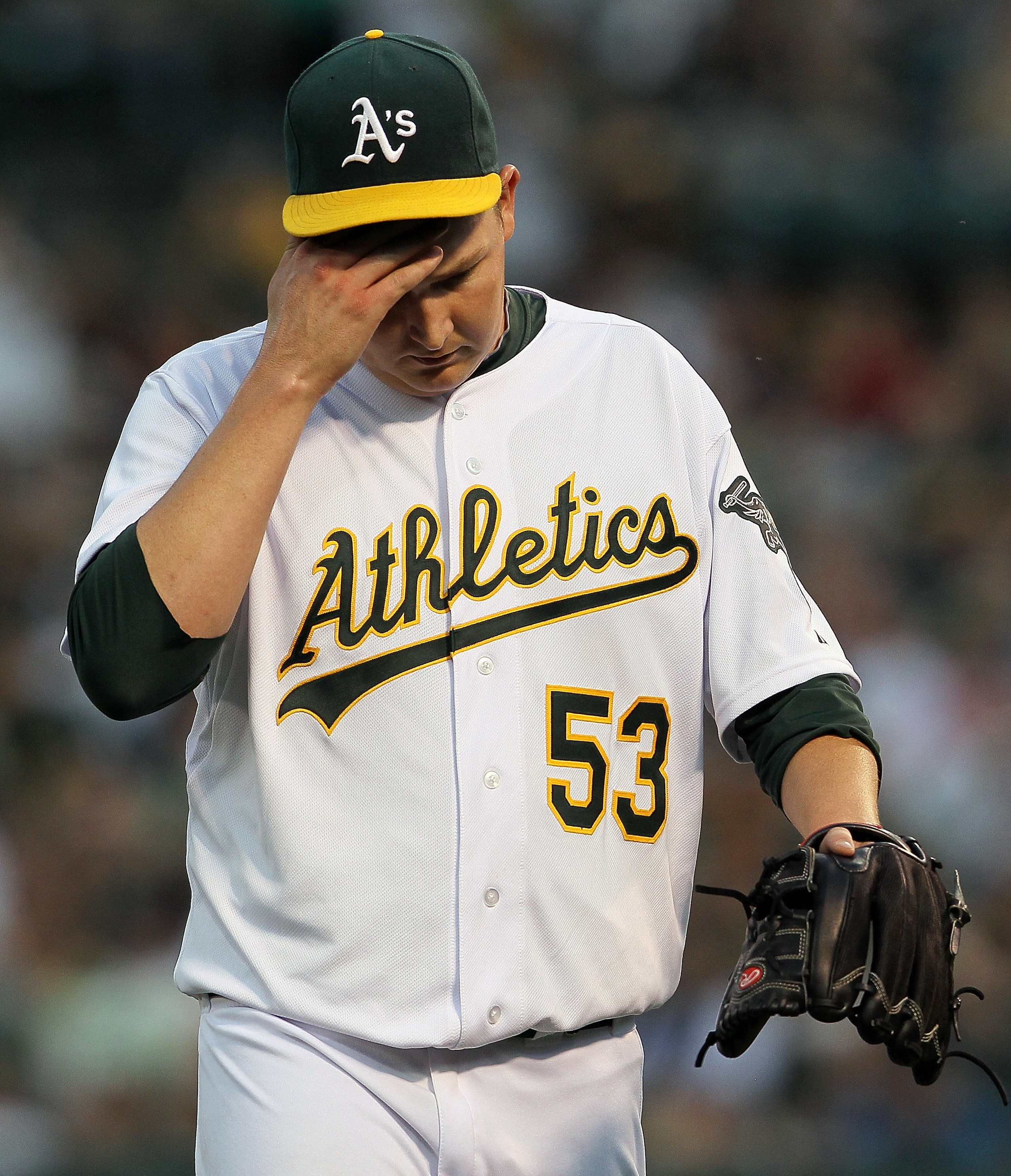 OAKLAND, CA - APRIL 01:  Trevor Cahill #53 of the Oakland Athletics reacts at the end of the first inning against the Seattle Mariners at the Oakland-Alameda County Coliseum on April 1, 2011 in Oakland, California  (Photo by Justin Sullivan/Getty Images)