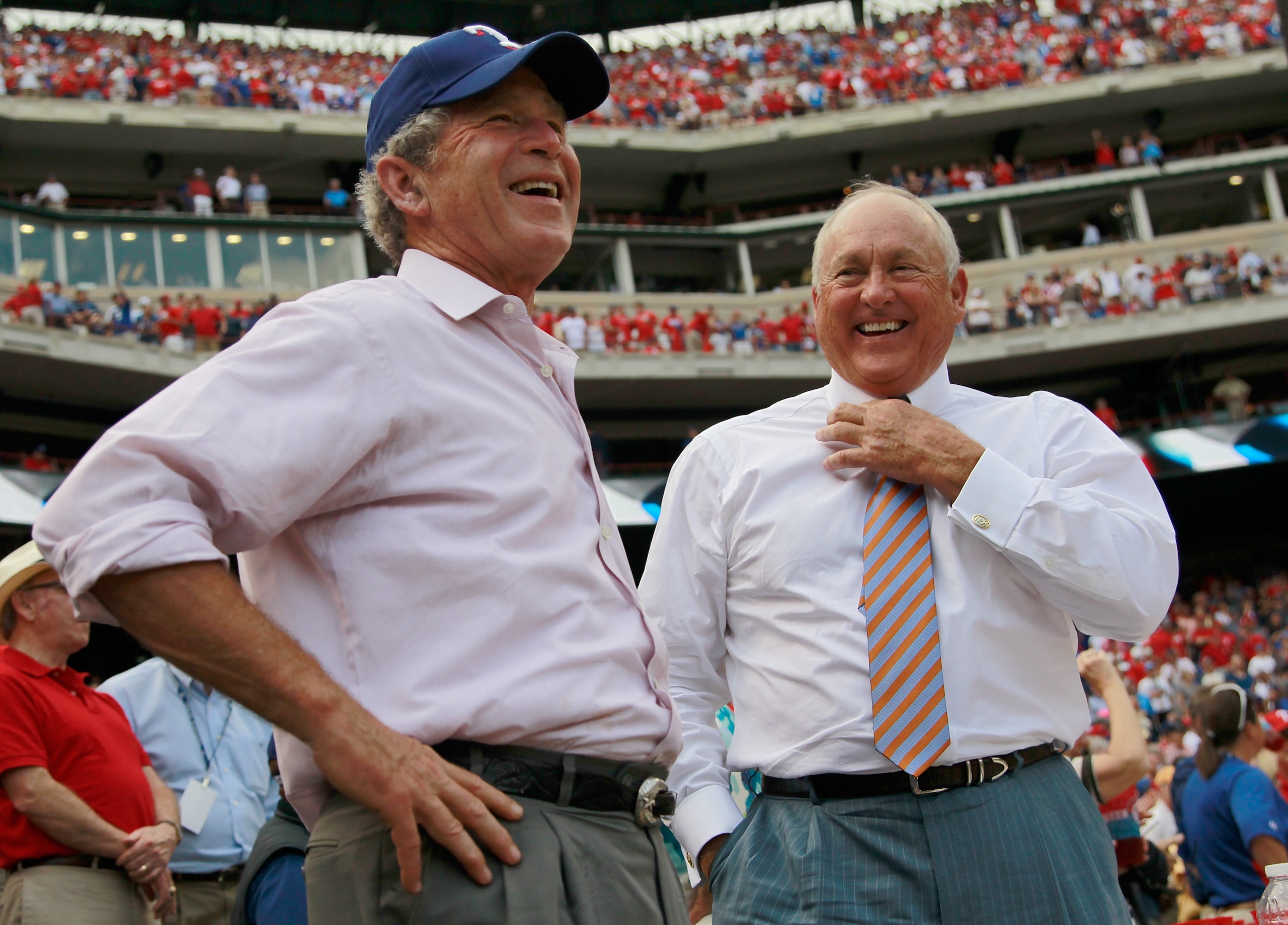 ARLINGTON, TX - APRIL 01:  Former U.S. President George W. Bush shares a laugh with Texas Rangers President and CEO Nolan Ryan on Opening Day at Rangers Ballpark in Arlington on April 1, 2011 in Arlington, Texas.  (Photo by Tom Pennington/Getty Images)