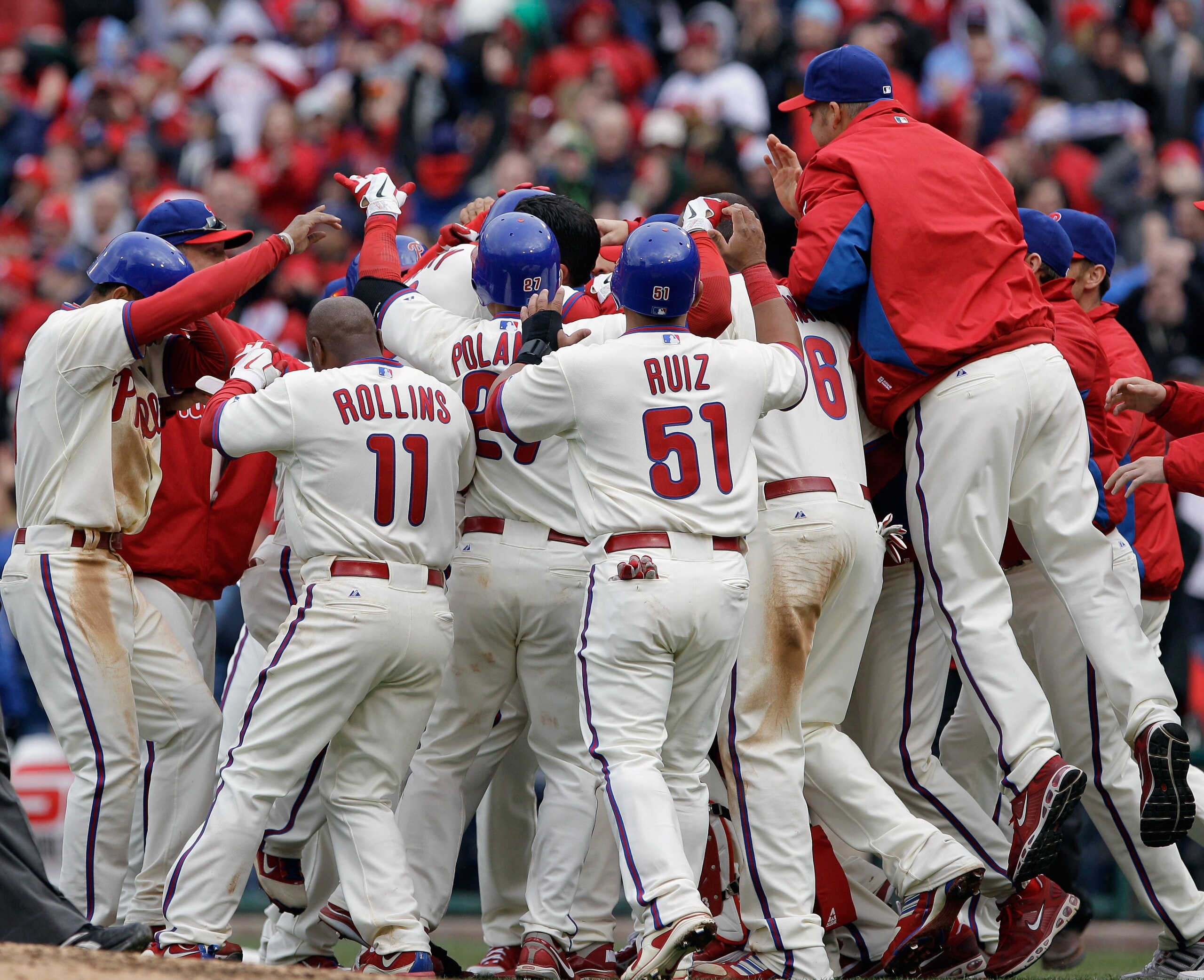 PHILADELPHIA, PA - APRIL 01:  Members of the Philadelphia Phillies celebrate after defeating the Houston Astros 5-4 during opening day at Citizens Bank Park on April 1, 2011 in Philadelphia, Pennsylvania.  (Photo by Rob Carr/Getty Images)