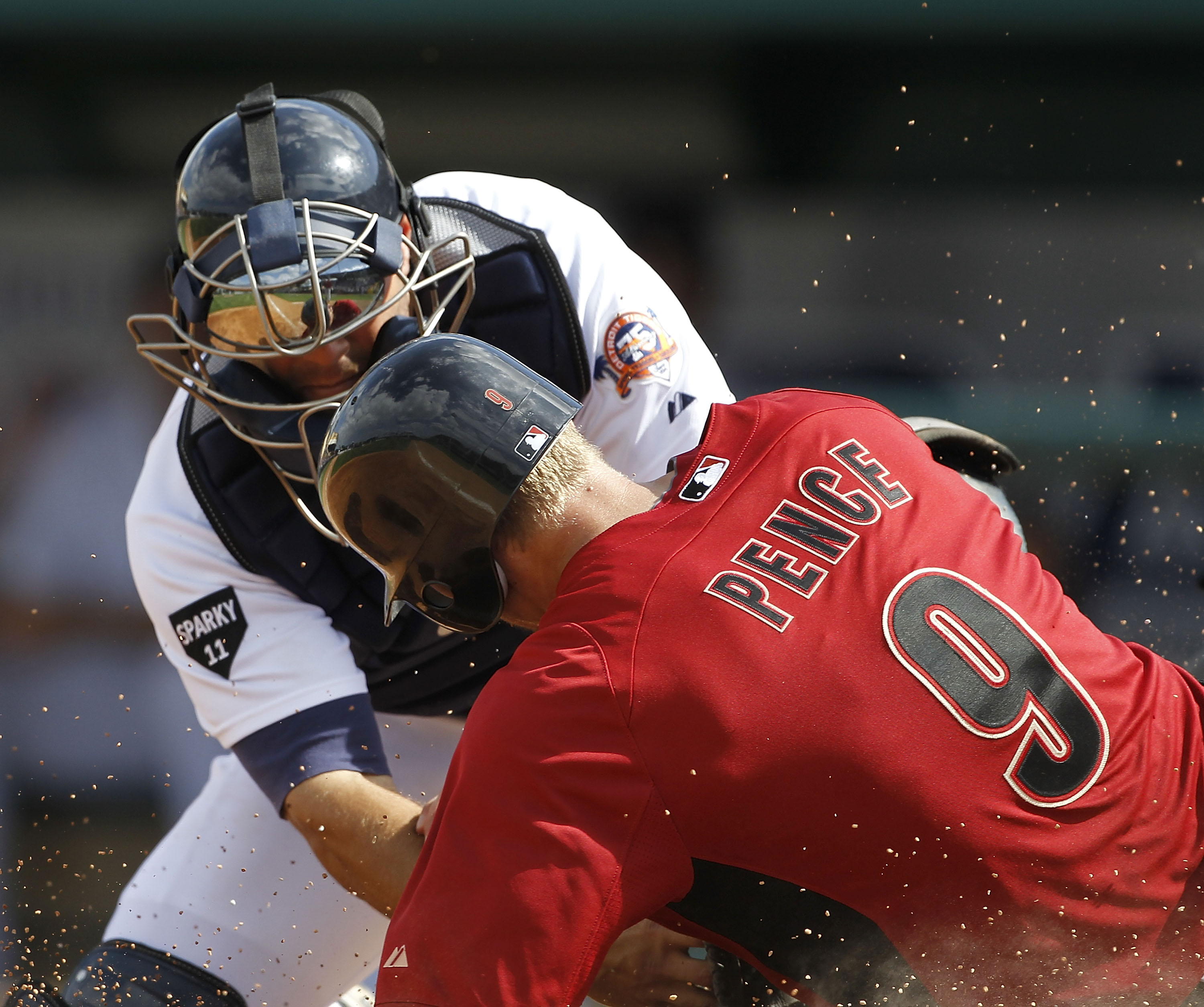 LAKELAND, FL - MARCH 02:  Alex Avila #13 of the Detroit Tigers tags out Hunter Pence #9 of the Houston Astros during the game at Joker Marchant Stadium on March 2, 2011 in Lakeland, Florida. The Astros defeated the Tigers 6-3.  (Photo by Leon Halip/Getty
