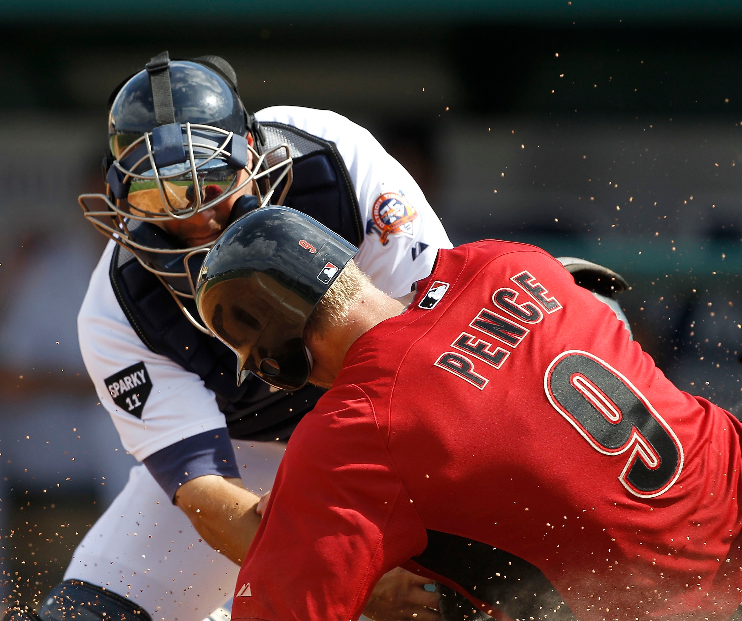 LAKELAND, FL - MARCH 02:  Alex Avila #13 of the Detroit Tigers tags out Hunter Pence #9 of the Houston Astros during the game at Joker Marchant Stadium on March 2, 2011 in Lakeland, Florida. The Astros defeated the Tigers 6-3.  (Photo by Leon Halip/Getty