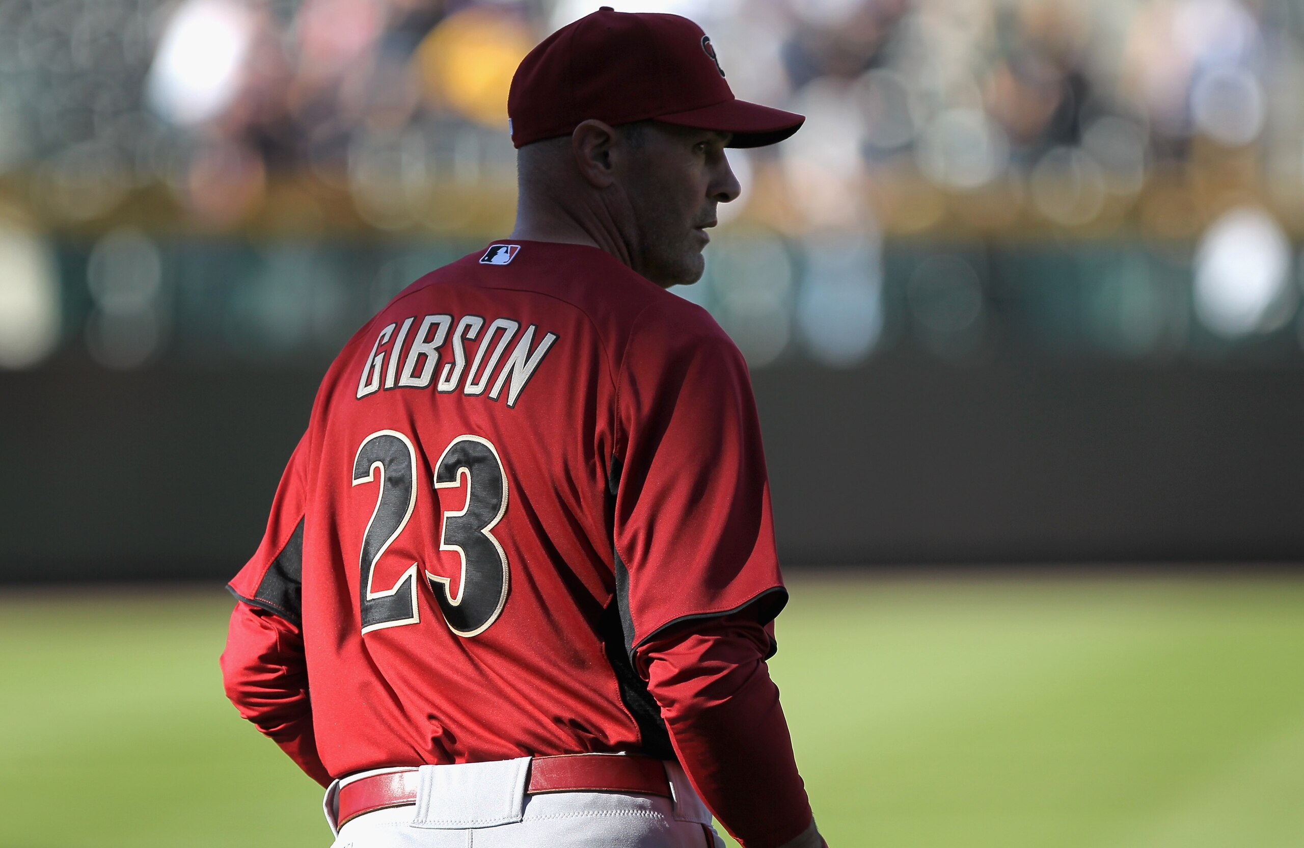 DENVER, CO - APRIL 02:  Manager Kirk Gibson #23 of the Arizona Diamondbacks watches his team as they take batting practice prior to facing the Colorado Rockies at Coors Field on April 2, 2011 in Denver, Colorado. The Rockies defeated the Diamondbacks 3-1.