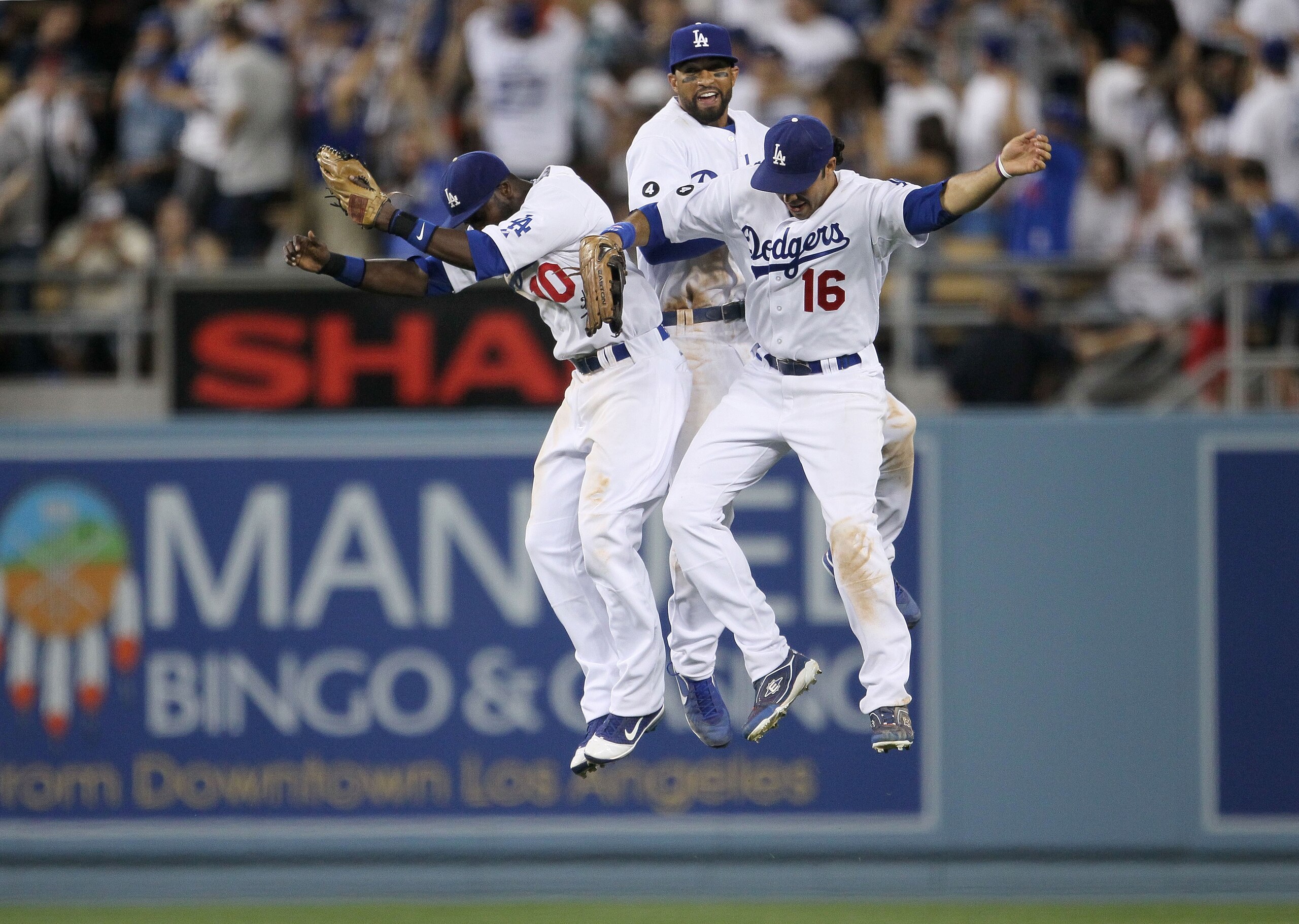 LOS ANGELES, CA - MARCH 31:  Tony Gwynn #10, Matt Kemp #27 and Andre Ethier #16 of the Los Angeles Dodgers celebrate their 2-1 win over the San Francisco Giants on Opening Day at Dodger Stadium on March 31, 2011 in Los Angeles, California.  (Photo by Jeff