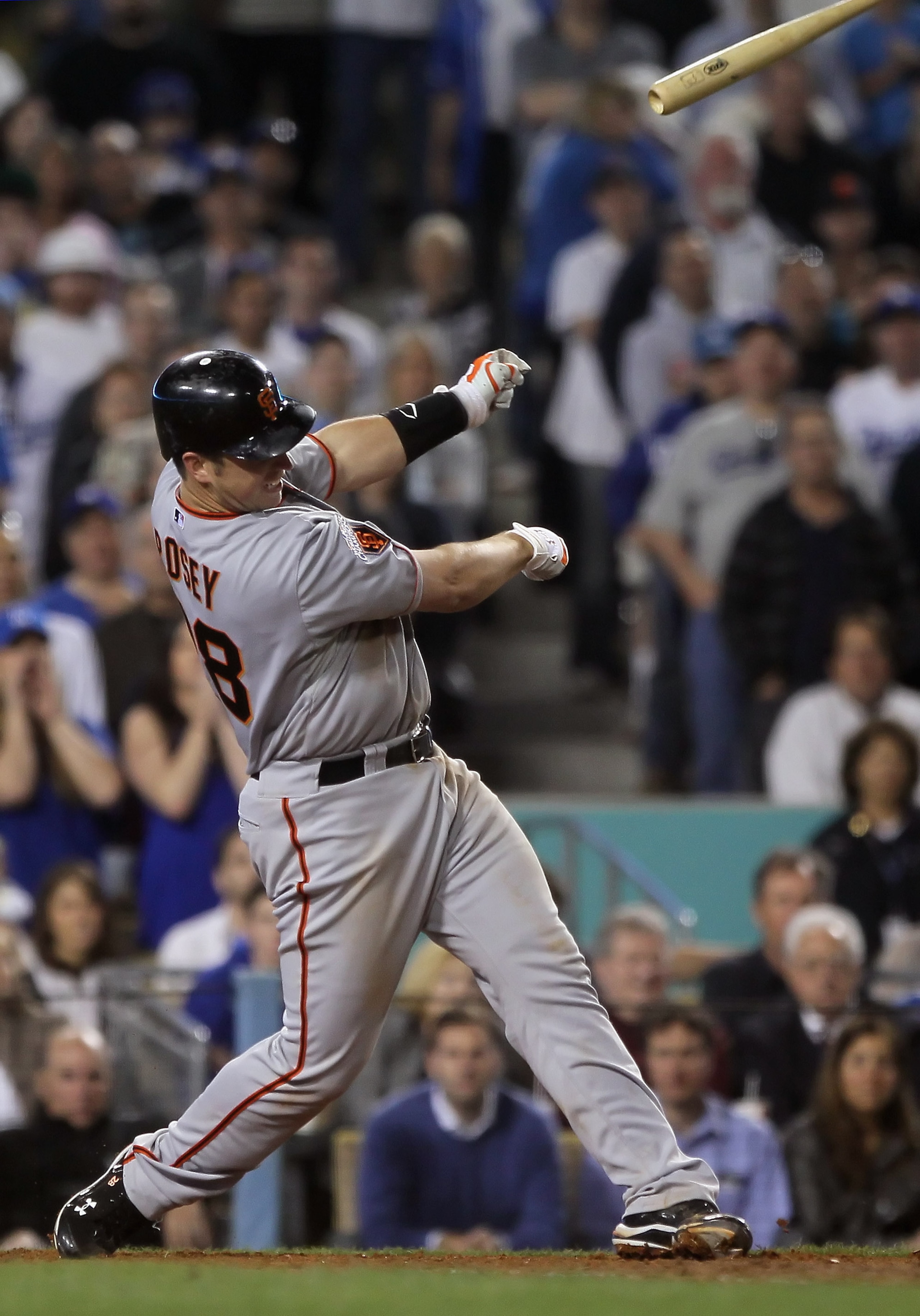 LOS ANGELES, CA - APRIL 01:  Buster Posey #28 of the San Francisco Giants loses his bat after striking out in the seventh inning against the Los Angeles Dodgers at Dodger Stadium on April 1, 2011 in Los Angeles, California. The Dodgers defeated the Giants