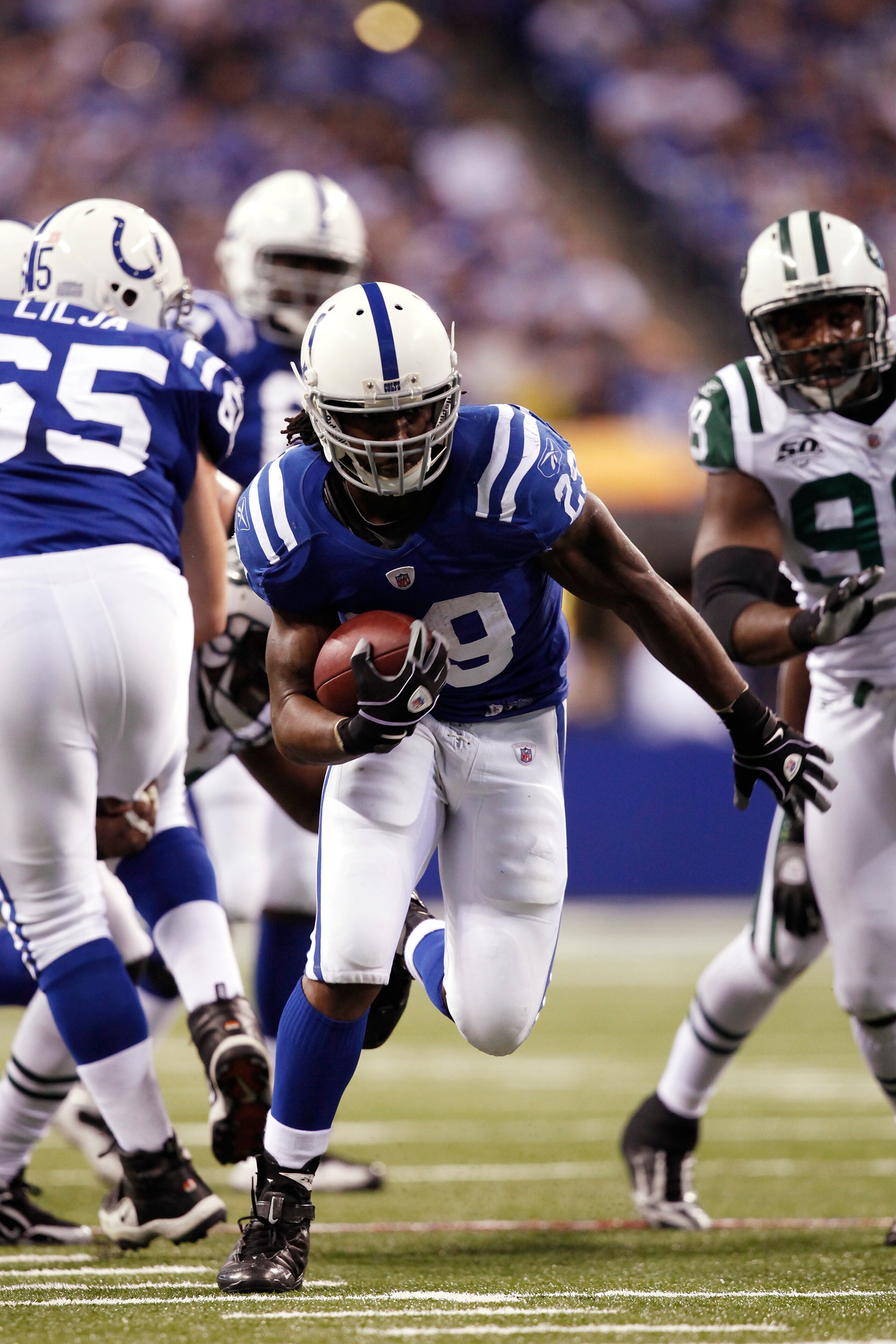 INDIANAPOLIS, IN - DECEMBER 27: Joseph Addai #29 of the Indianapolis Colts runs for a 21-yard touchdown in the first quarter against the New York Jets at Lucas Oil Stadium on December 27, 2009 in Indianapolis, Indiana. (Photo by Joe Robbins/Getty Images)