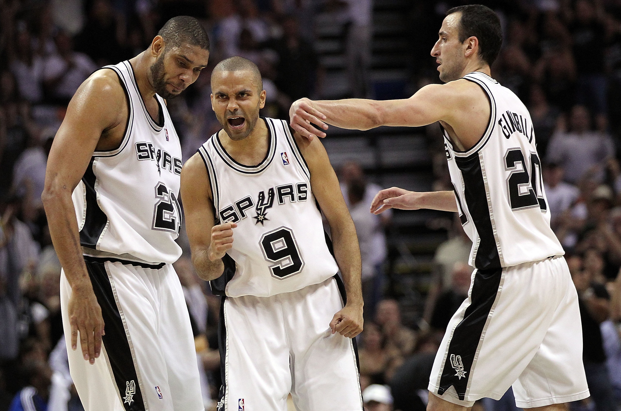 SAN ANTONIO - APRIL 23: Tony Parker #9 of the San Antonio Spurs reacts with Tim Duncan #21 and Manu Ginobili #20 against the Dallas Mavericks in Game Three of the Western Conference Quarterfinals during the 2010 NBA Playoffs at AT&T Center on April 23, 20 SAN ANTONIO - APRIL 23: Tony Parker #9 of the San Antonio Spurs reacts with Tim Duncan #21 and Manu Ginobili #20 against the Dallas Mavericks in Game Three of the Western Conference Quarterfinals during the 2010 NBA Playoffs at AT&T Center on April 23, 20