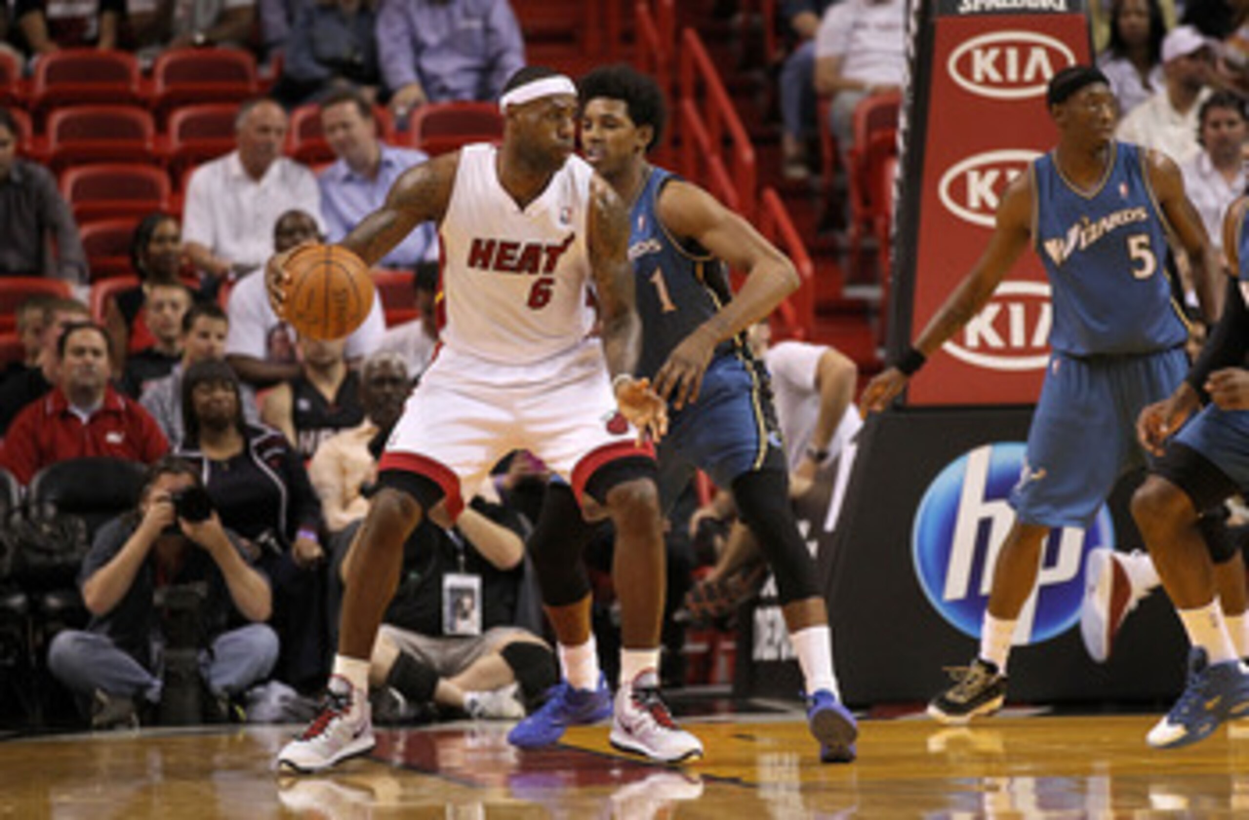 MIAMI, FL - FEBRUARY 25:  LeBron James #6 of the Miami Heat posts up against  Nick Young #1 of the Washington Wizards during a game at American Airlines Arena on February 25, 2011 in Miami, Florida. NOTE TO USER: User expressly acknowledges and agrees tha