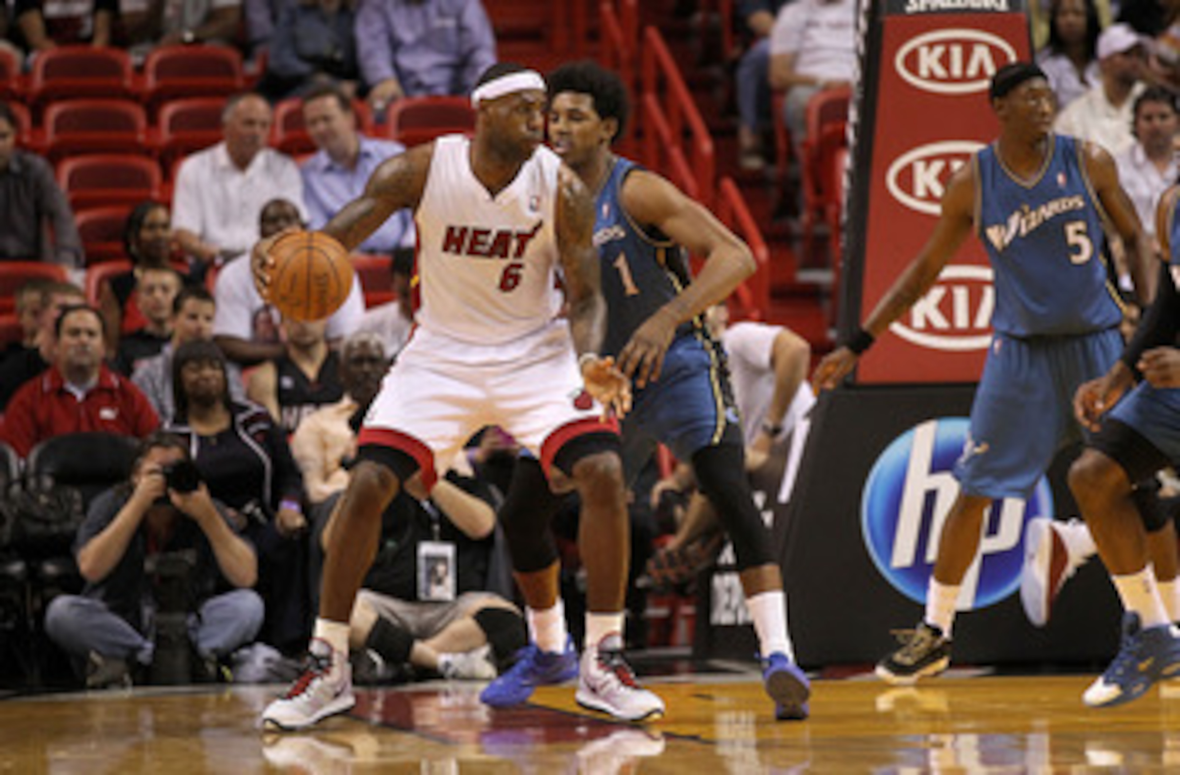 MIAMI, FL - FEBRUARY 25:  LeBron James #6 of the Miami Heat posts up against  Nick Young #1 of the Washington Wizards during a game at American Airlines Arena on February 25, 2011 in Miami, Florida. NOTE TO USER: User expressly acknowledges and agrees tha